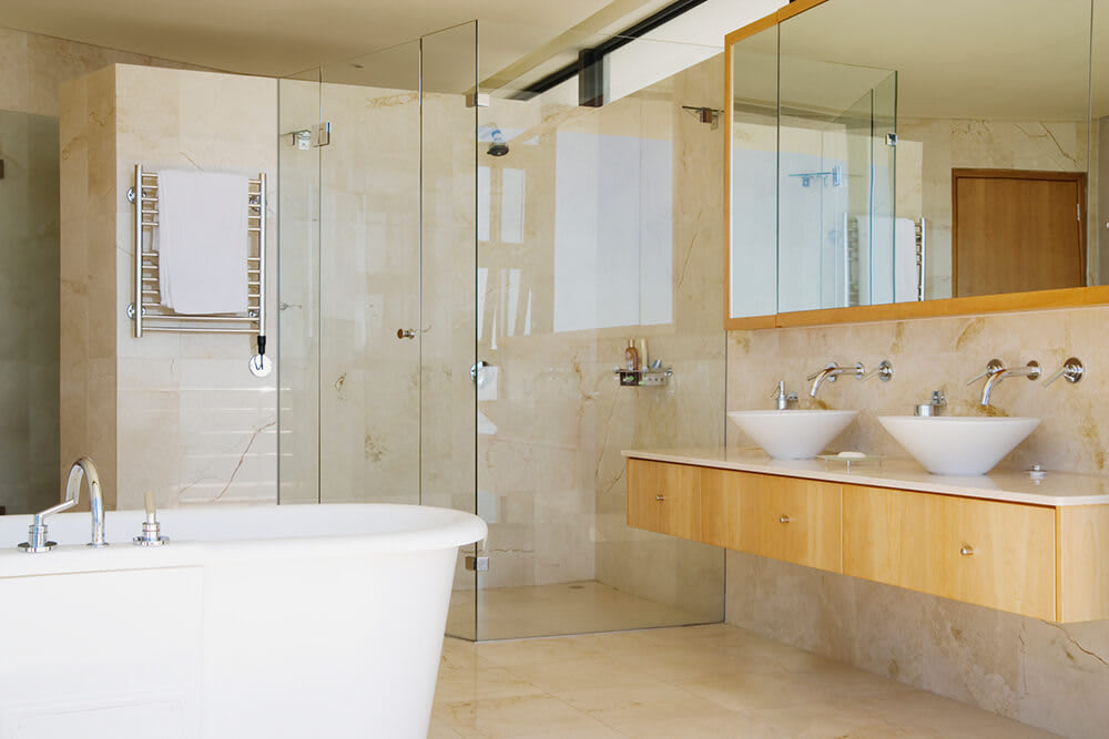 Frameless shower in a an open modern bathroom