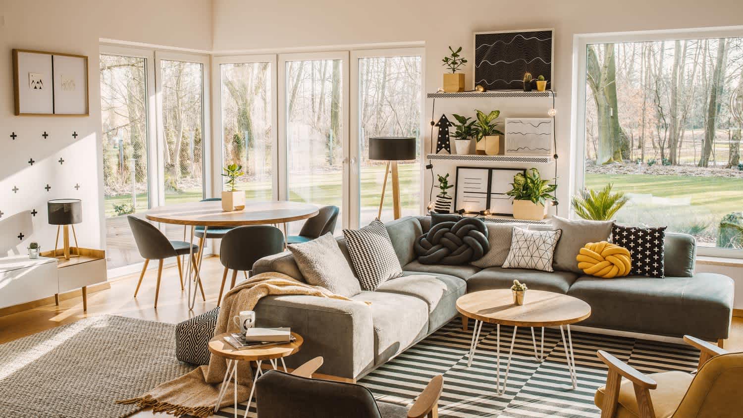 A bright beautiful living room with large windows