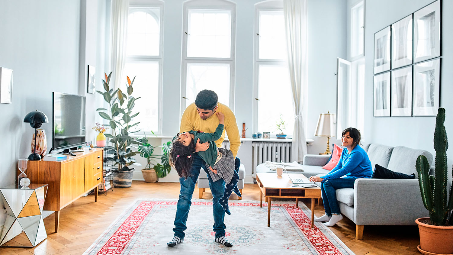 A family plays in a living room