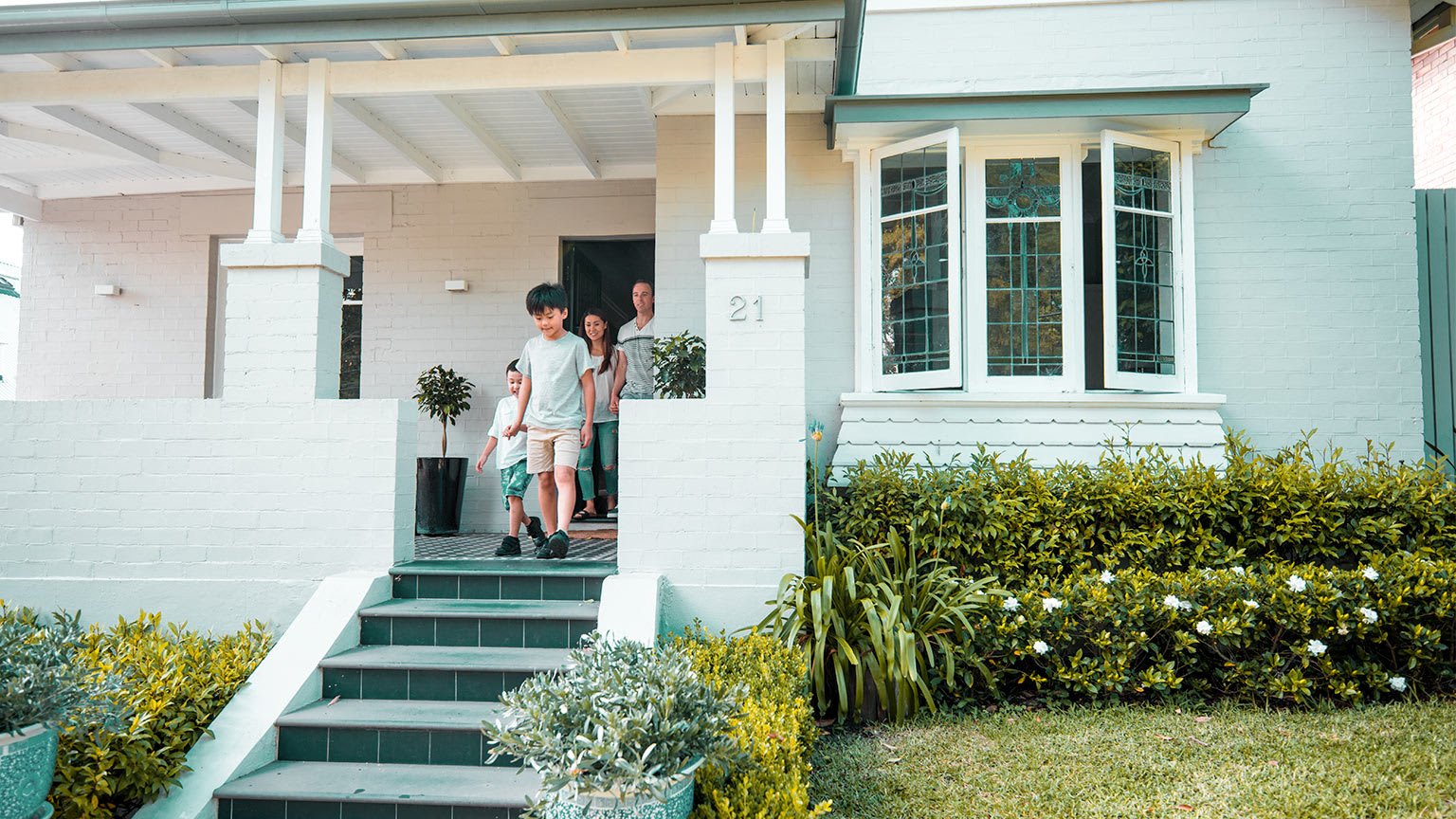 happy family walking out front door