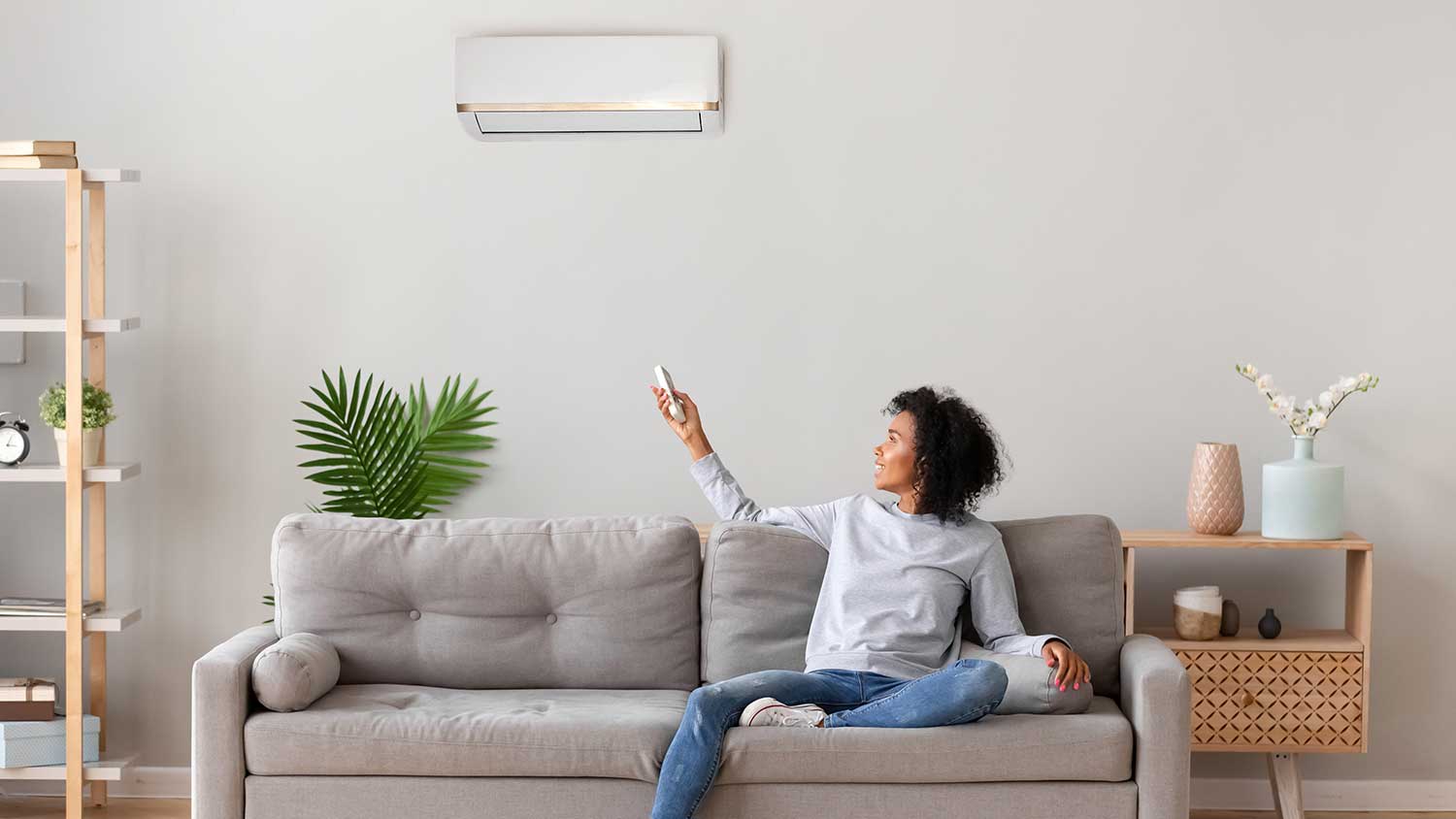Woman using home AC unit