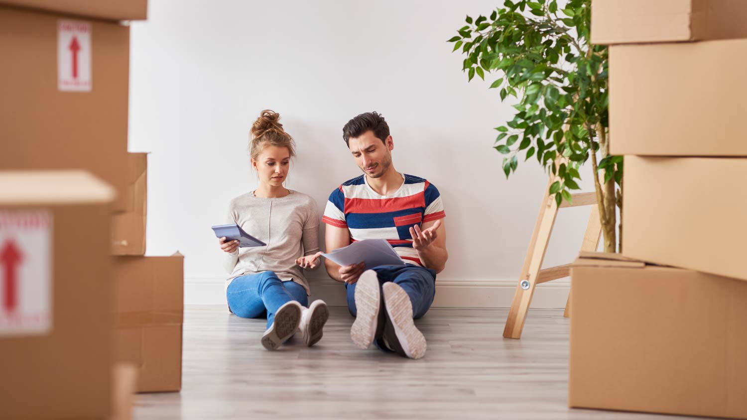 frustrated couple surrounded by boxes