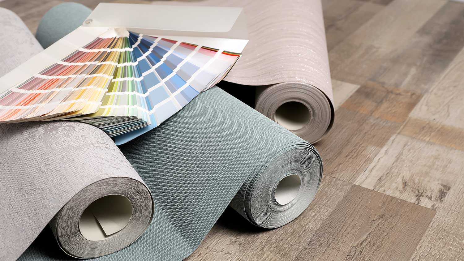 A view of wallpaper rolls and paint swatches