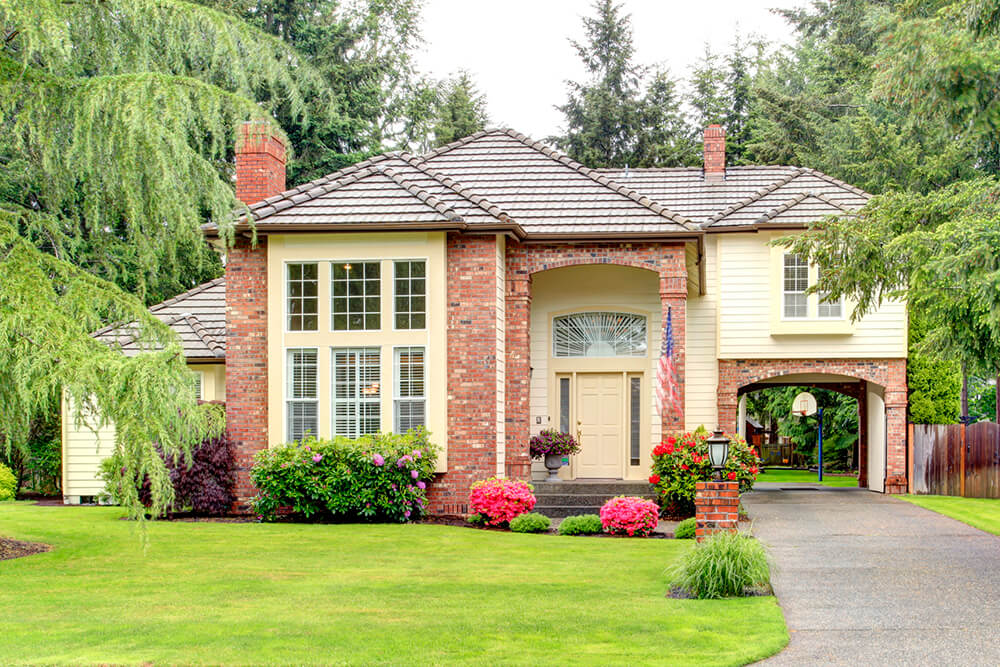 Large suburban home with brick siding