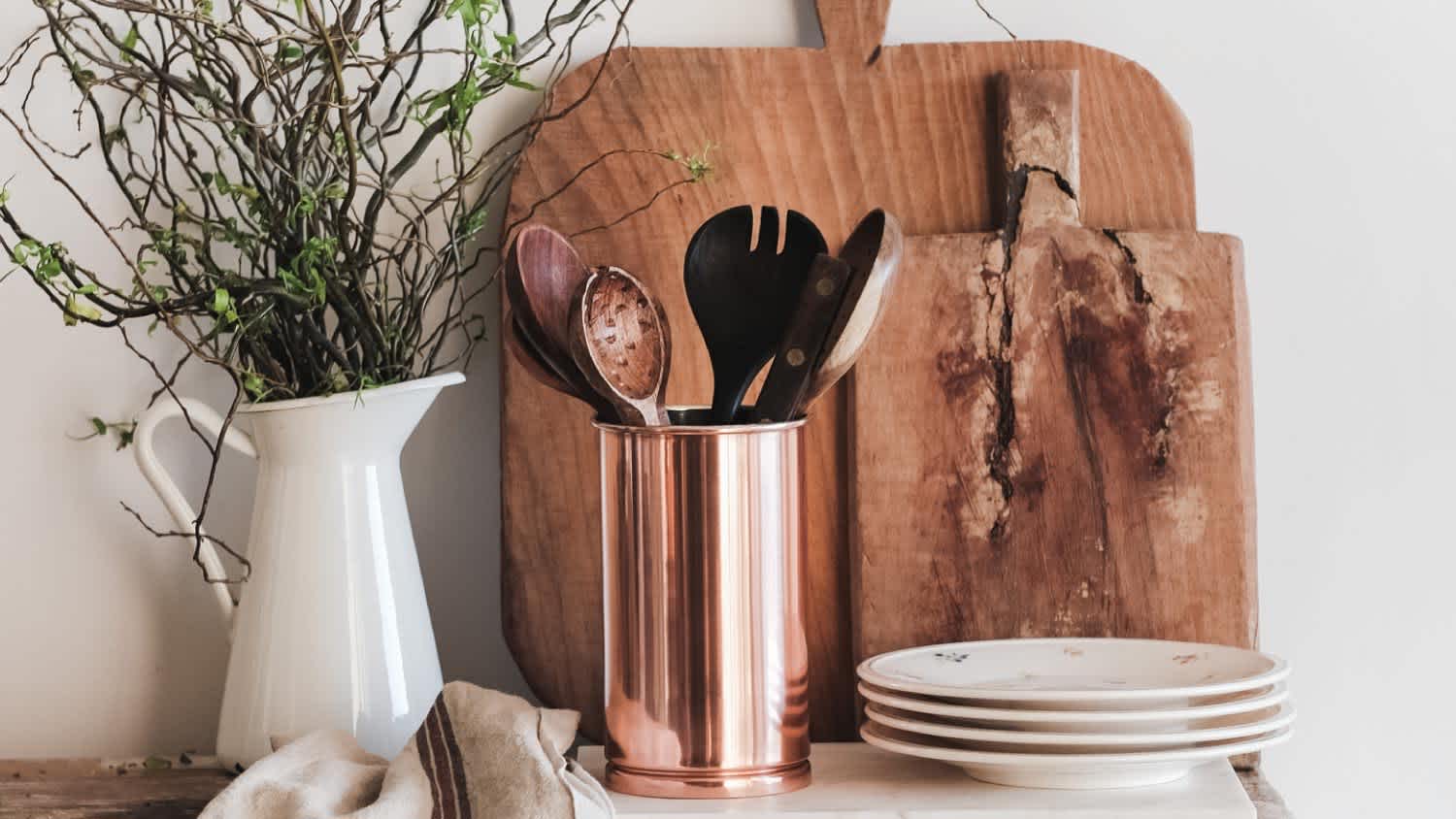 Chopping boards and plates on rustic counter