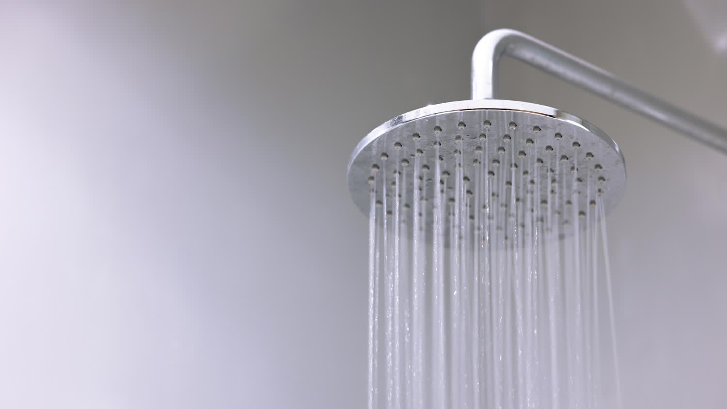 Water pouring from a modern shower head