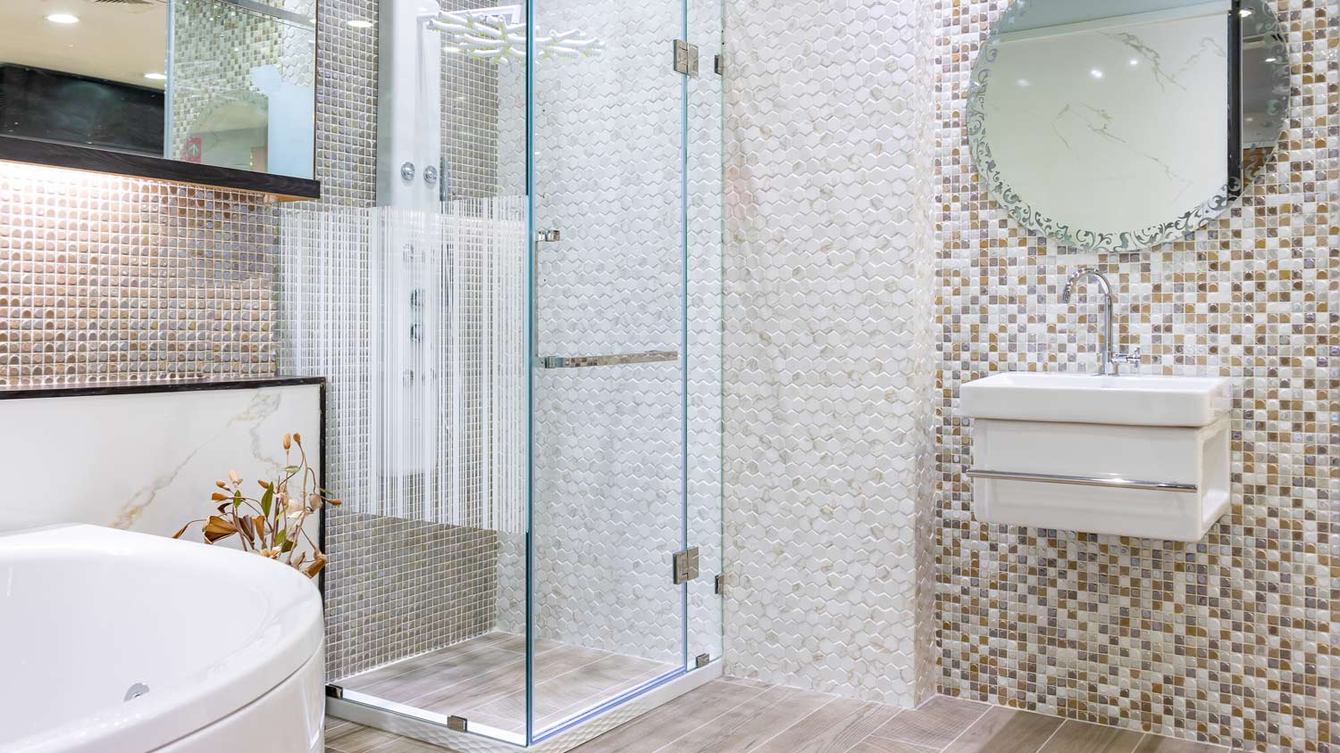 A bathroom with a shower cabin of glass