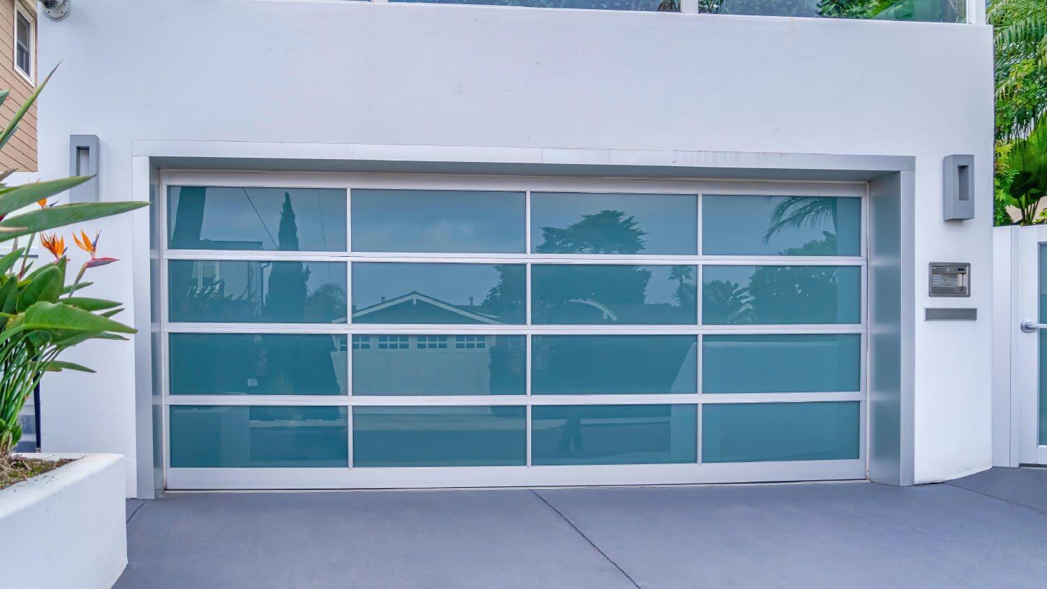 blue glass garage door in tropical area