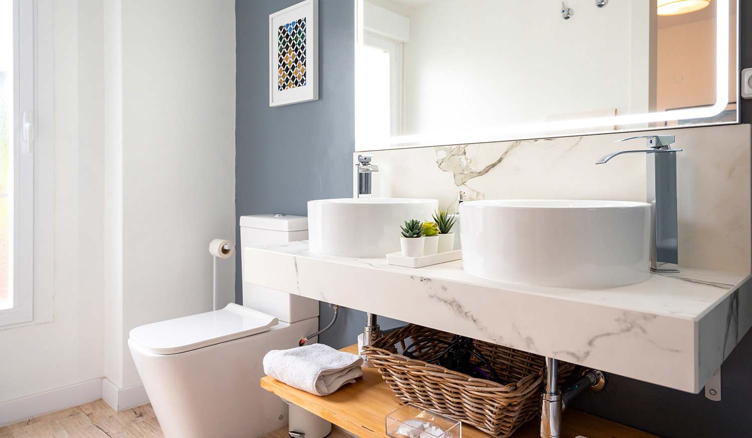 Light modern bathroom with dual sinks