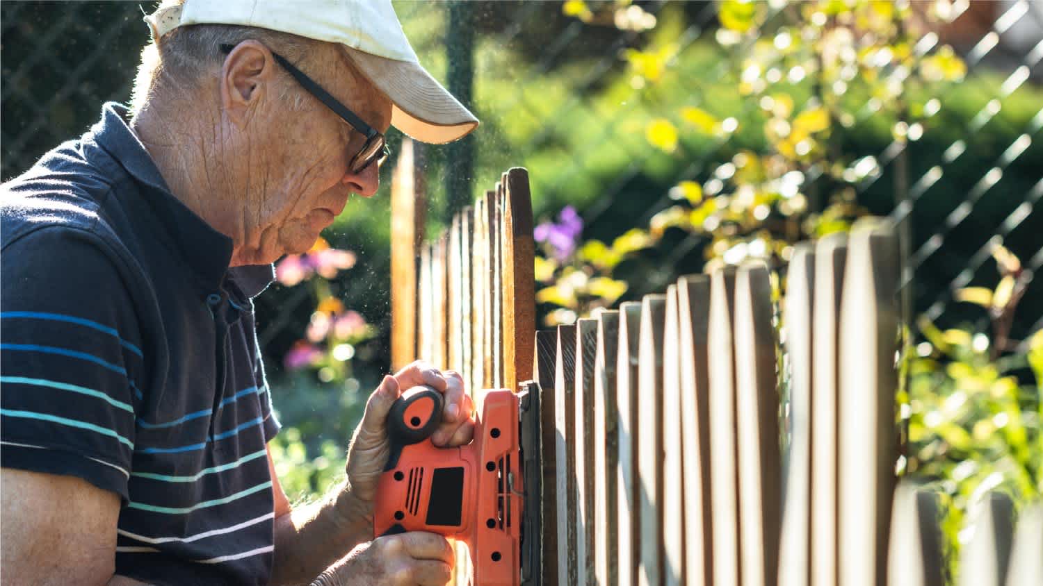 man installing fence covers