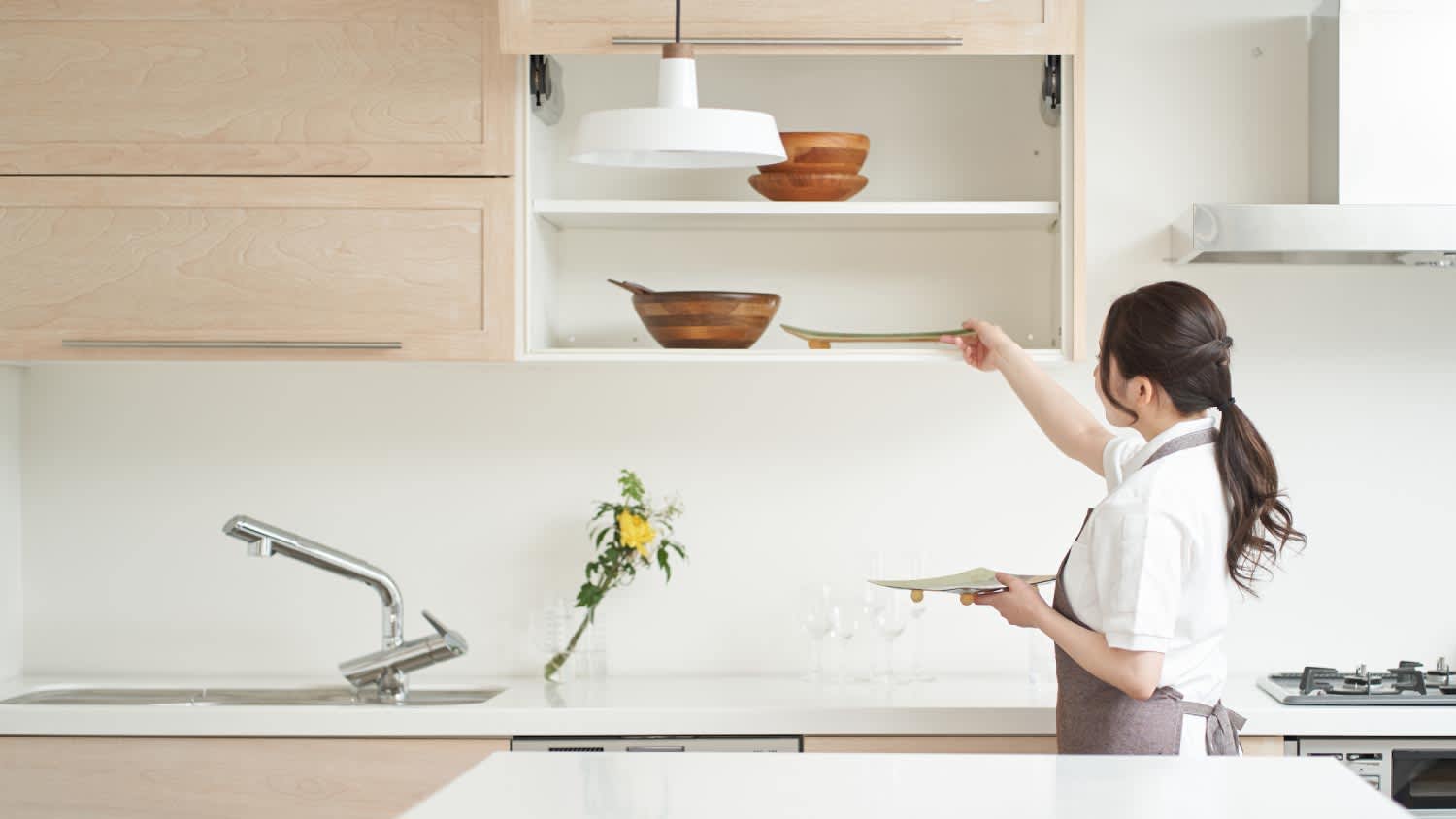 Woman organizing the kitchen