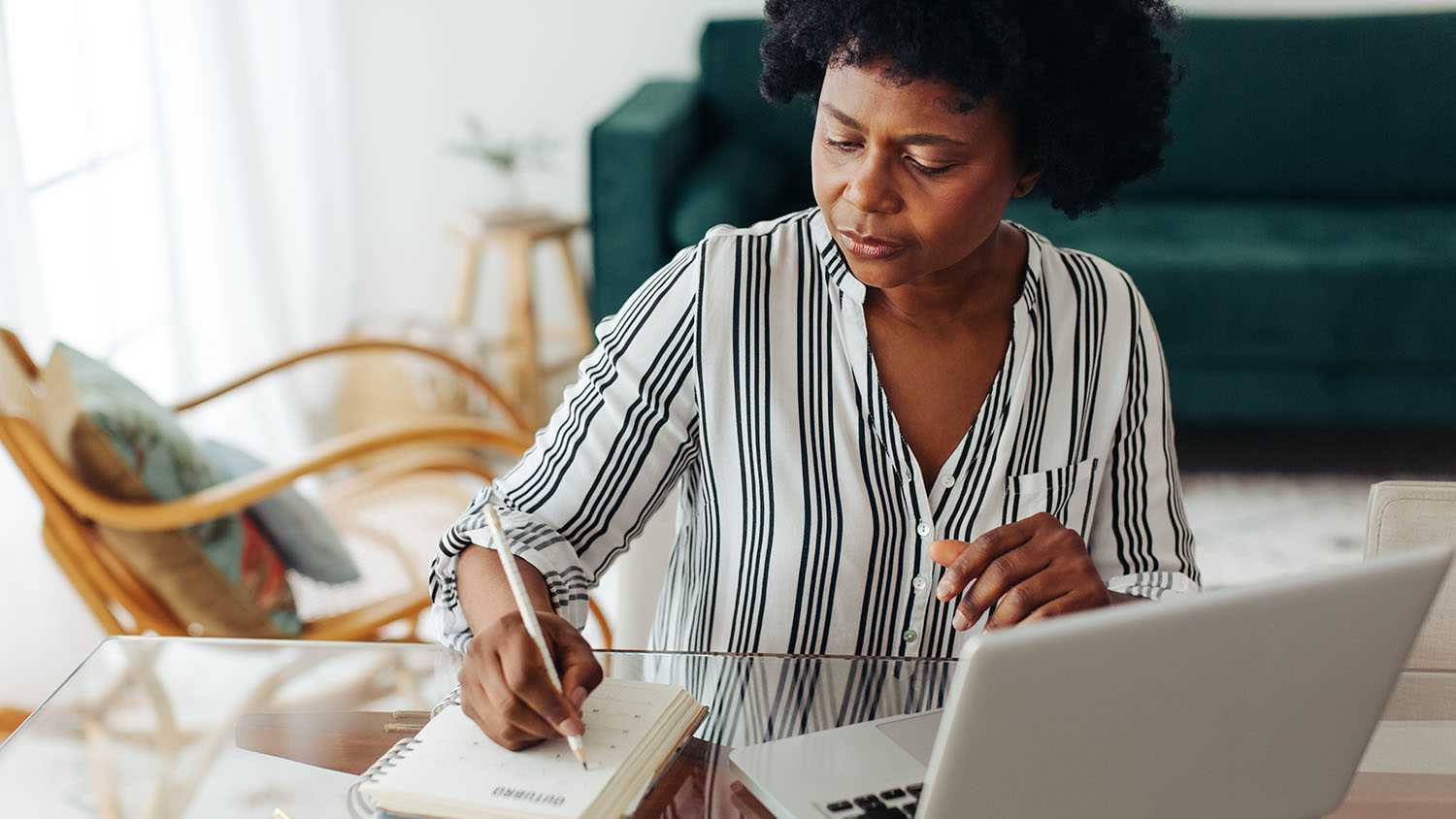 woman writing in planner