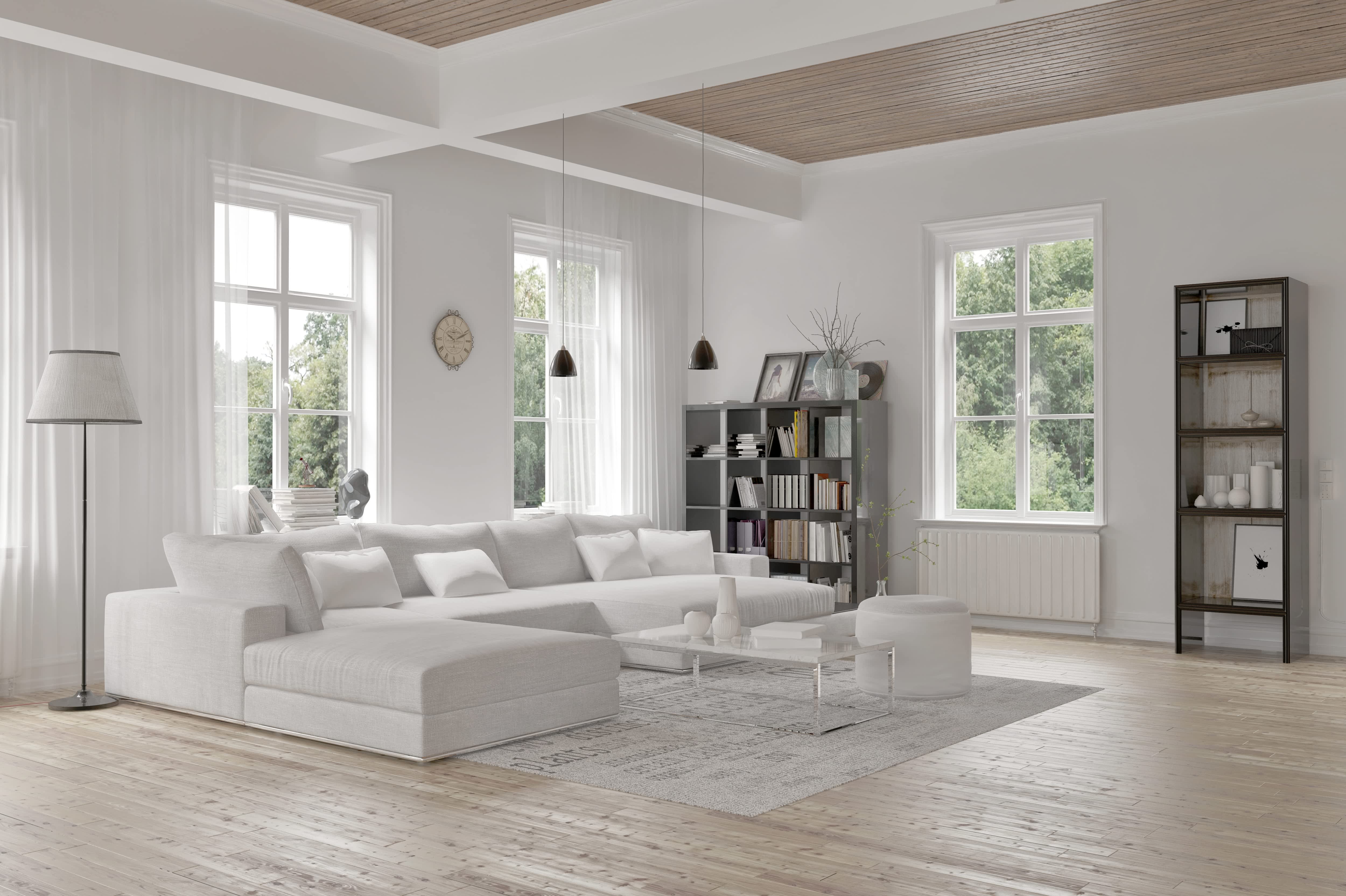A modern living room with minimalist design and white furniture