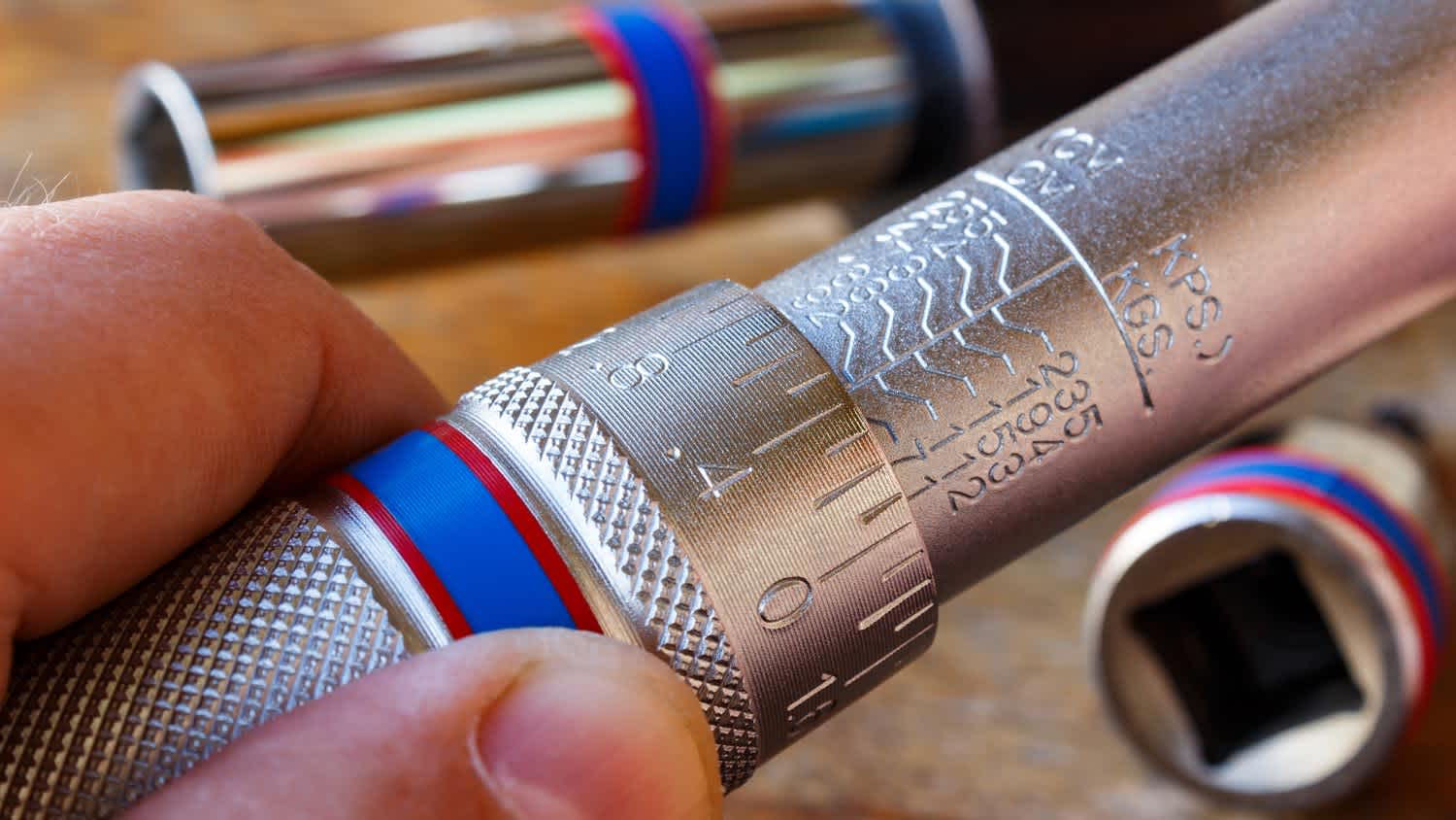 Close-up of a mechanic making adjustments to a torque wrench