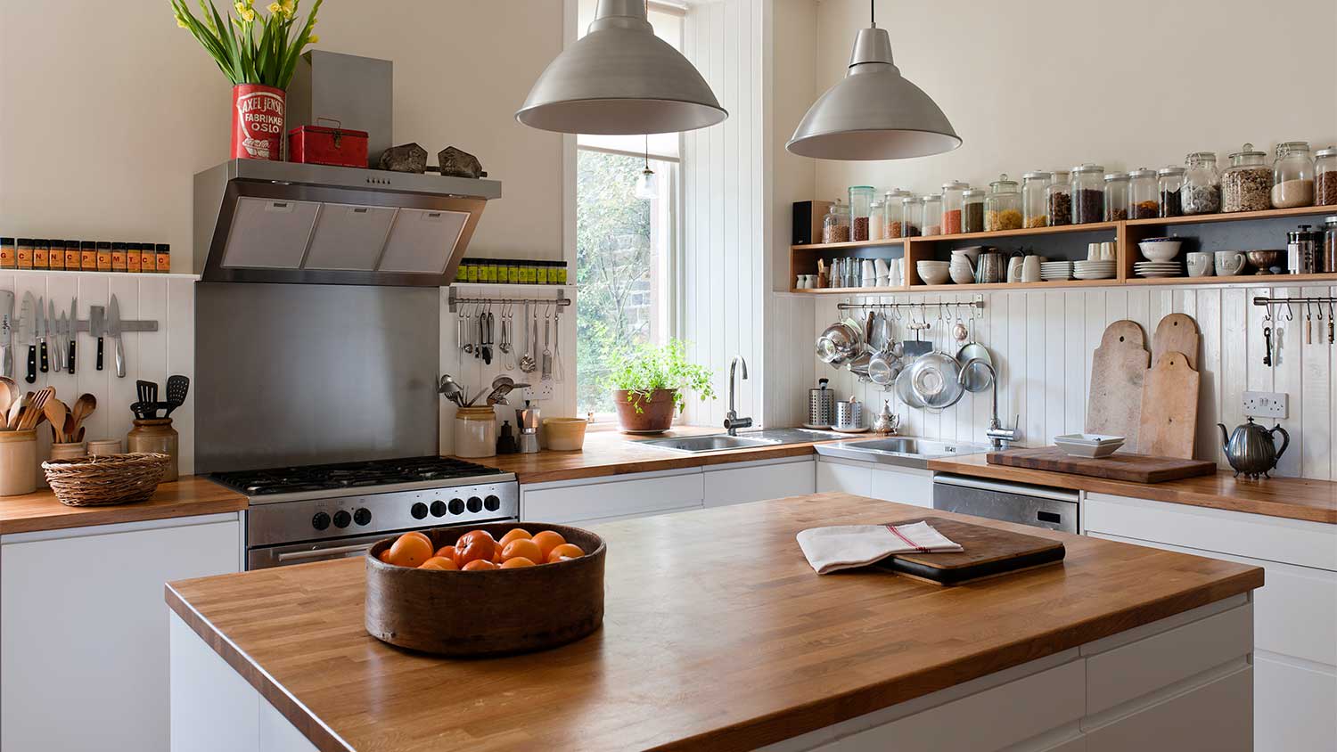 A view of a kitchen island with a bowl of fruit