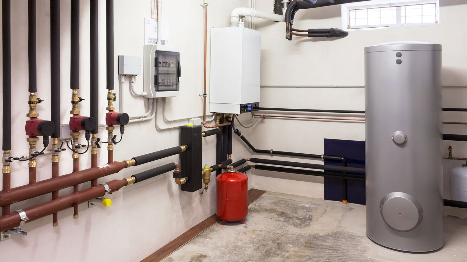 Condensing water heater in a boiler room