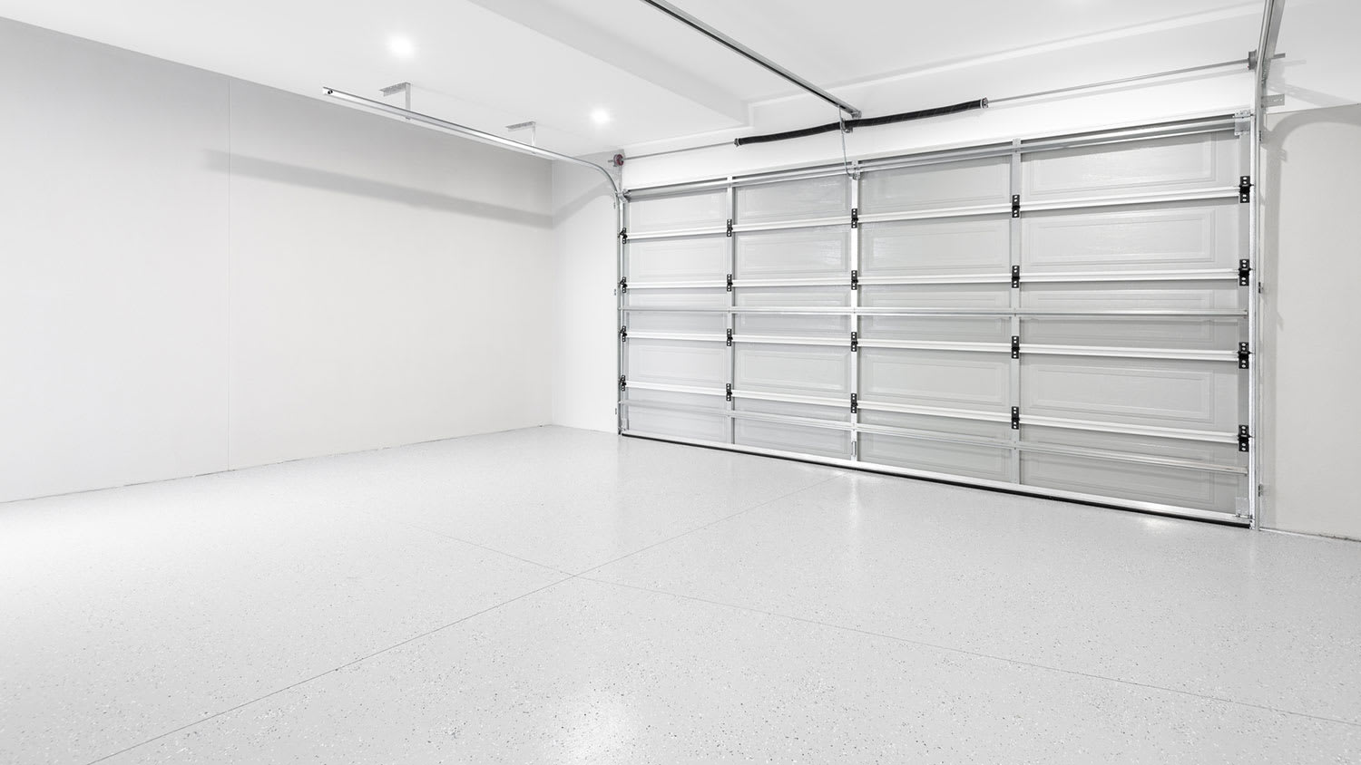 Bright clean garage interior with new concrete flooring