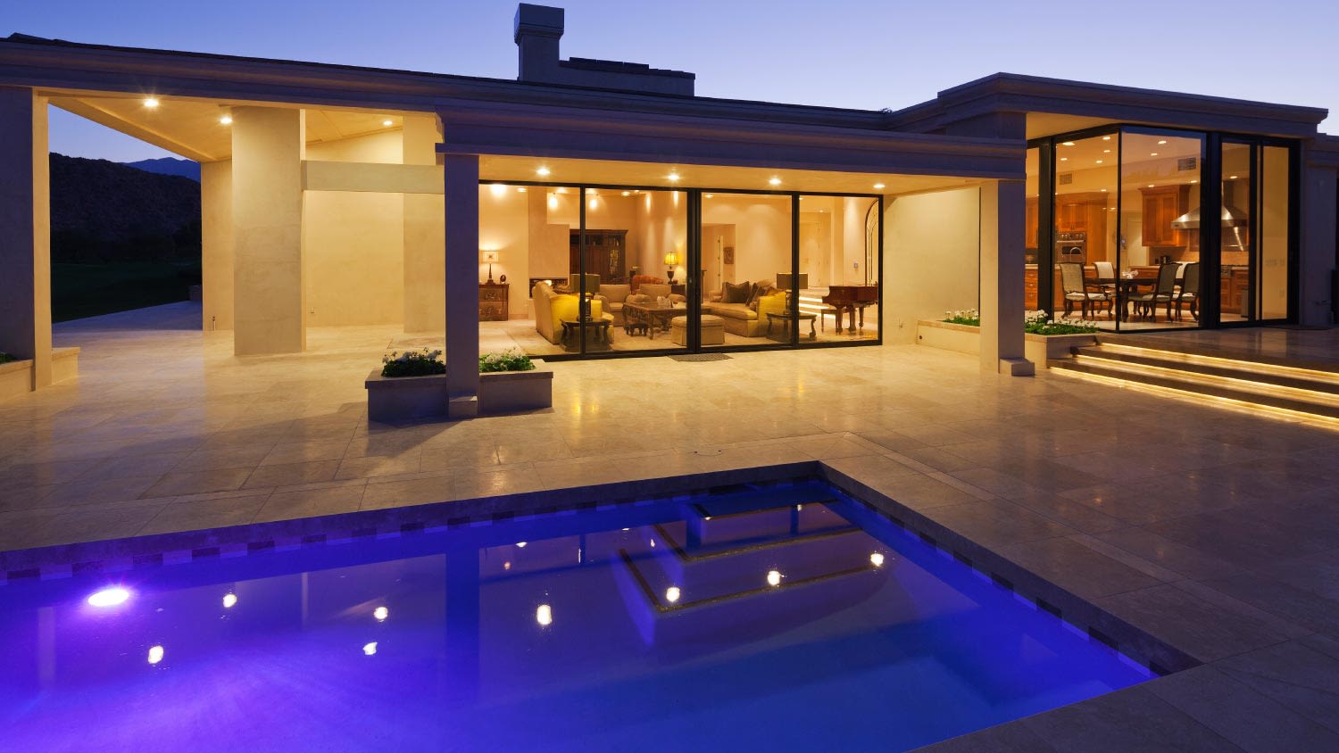 View of a modern home with swimming pool