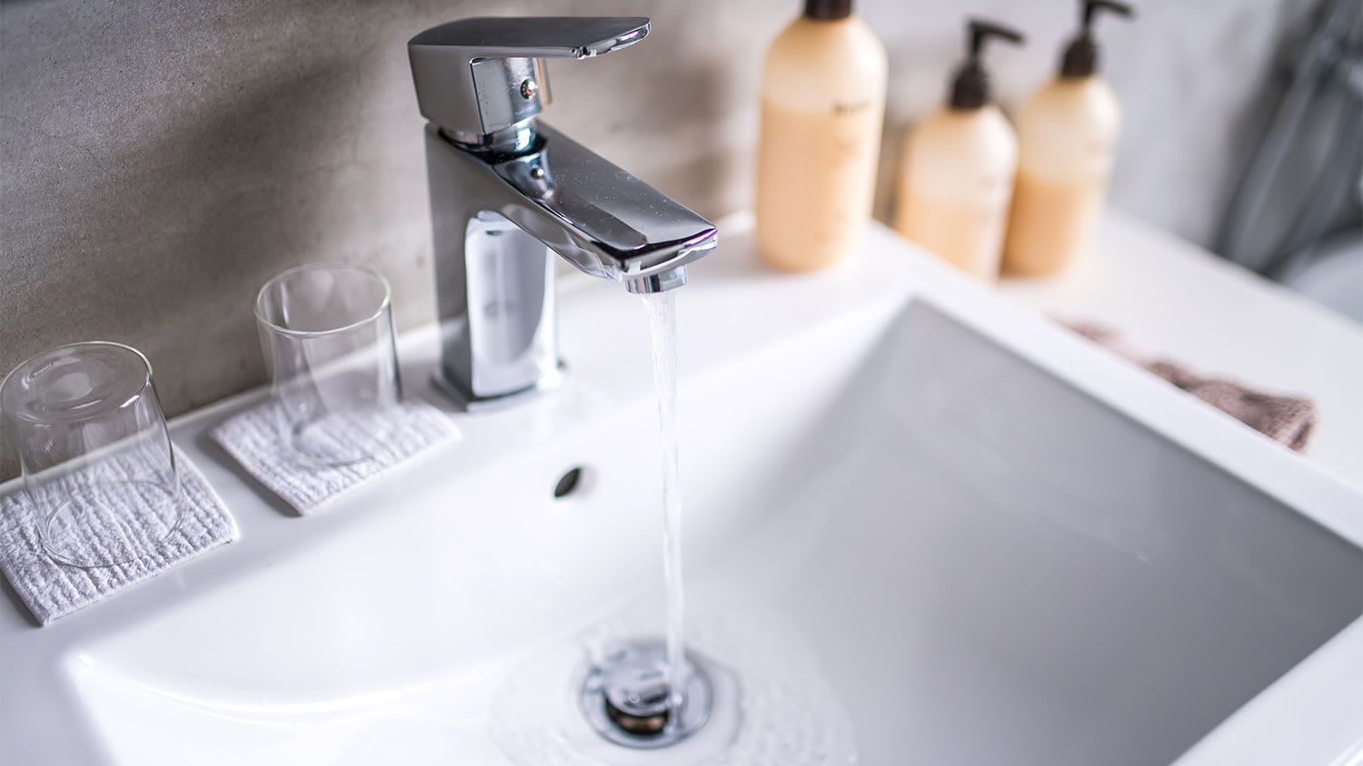 modern bathroom faucet running water