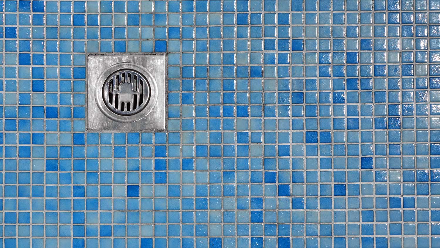 Blue tiled floor shower drain