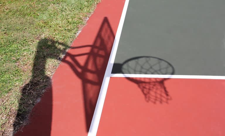 Shadow of basketball hoop