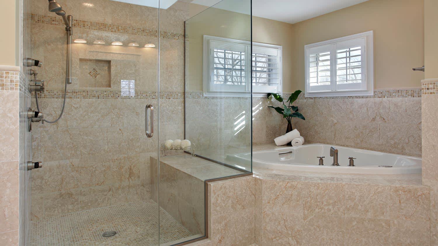 A luxurious bathroom with a glass shower room