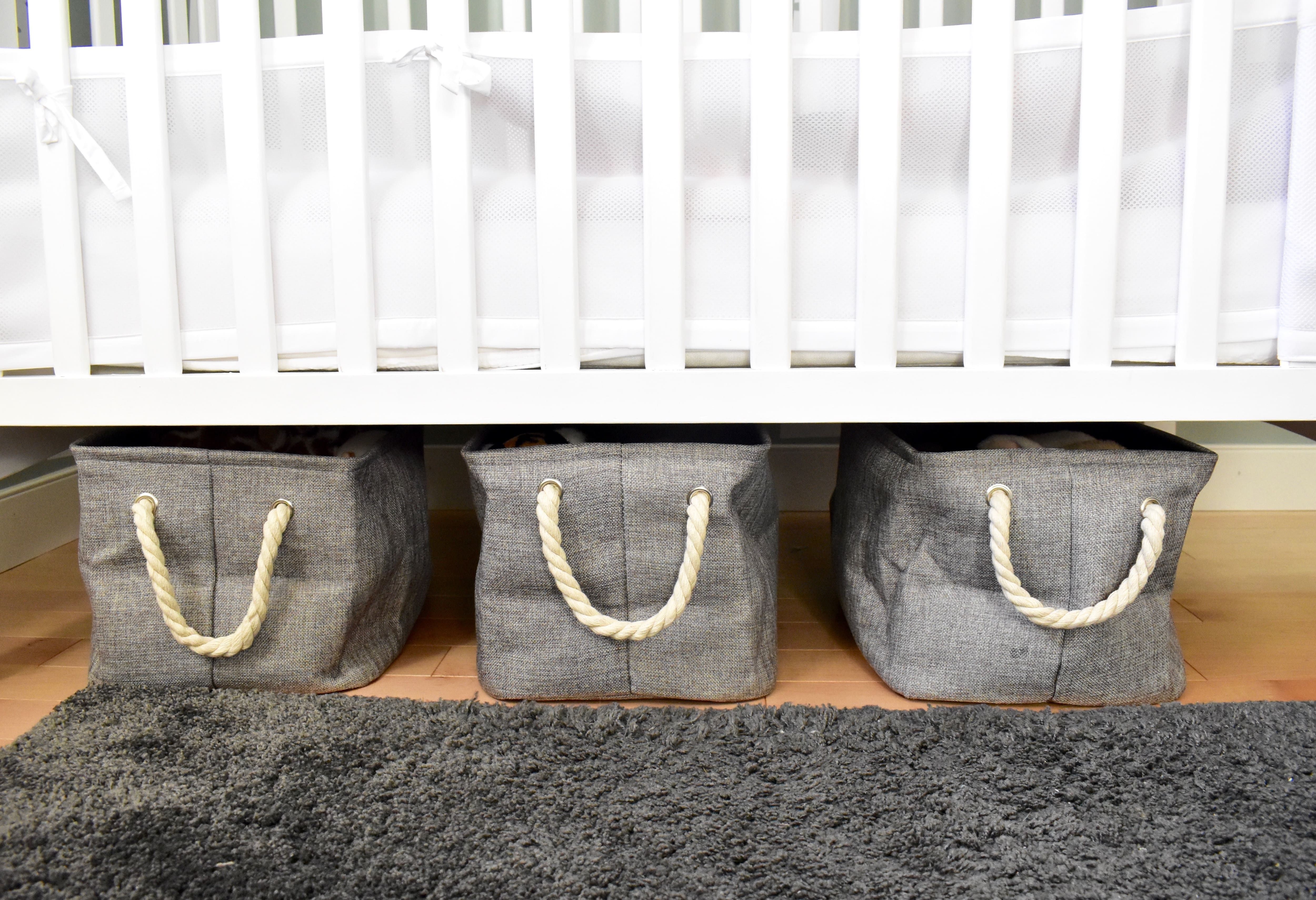 Storage clothes in a row under a crib