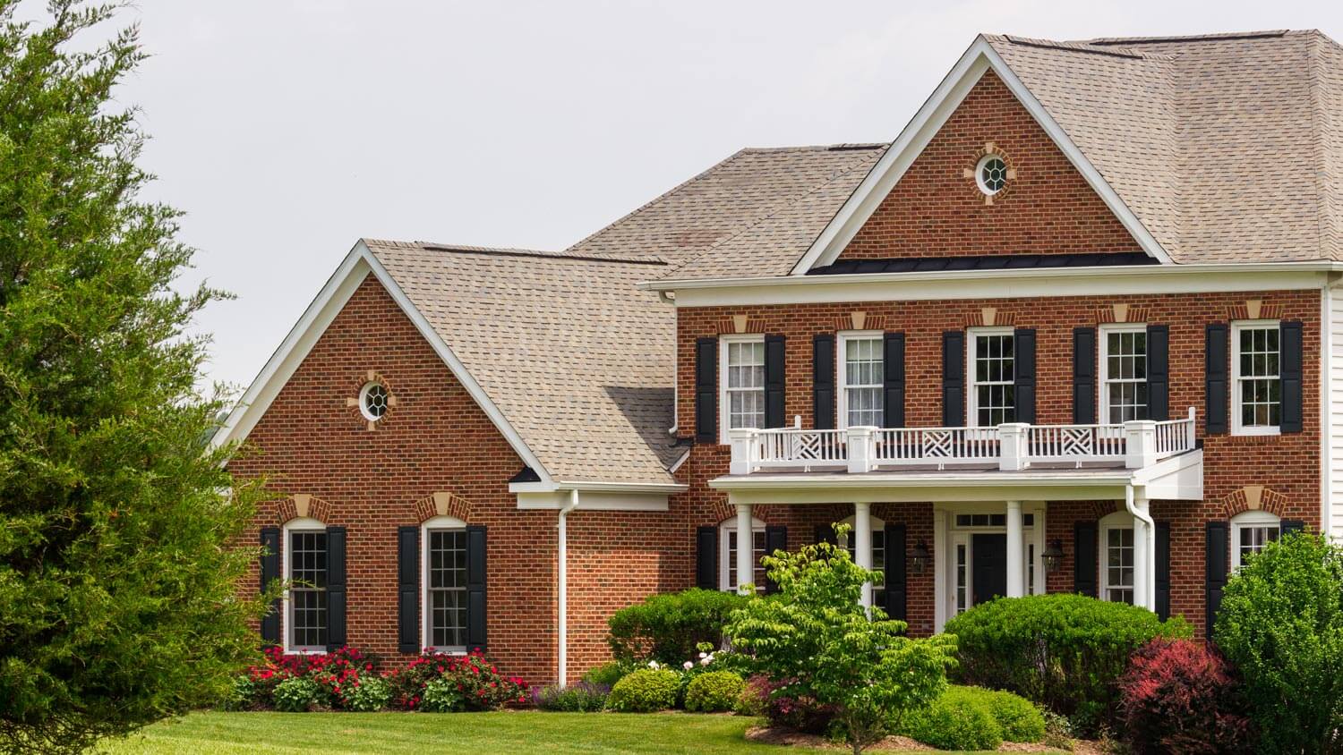 A large brick house with a yard
