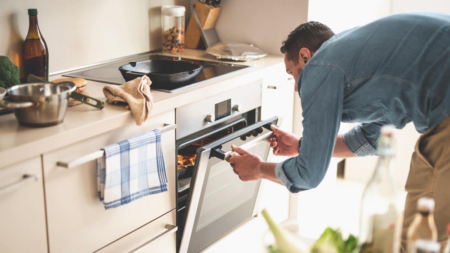 Man closing door of oven
