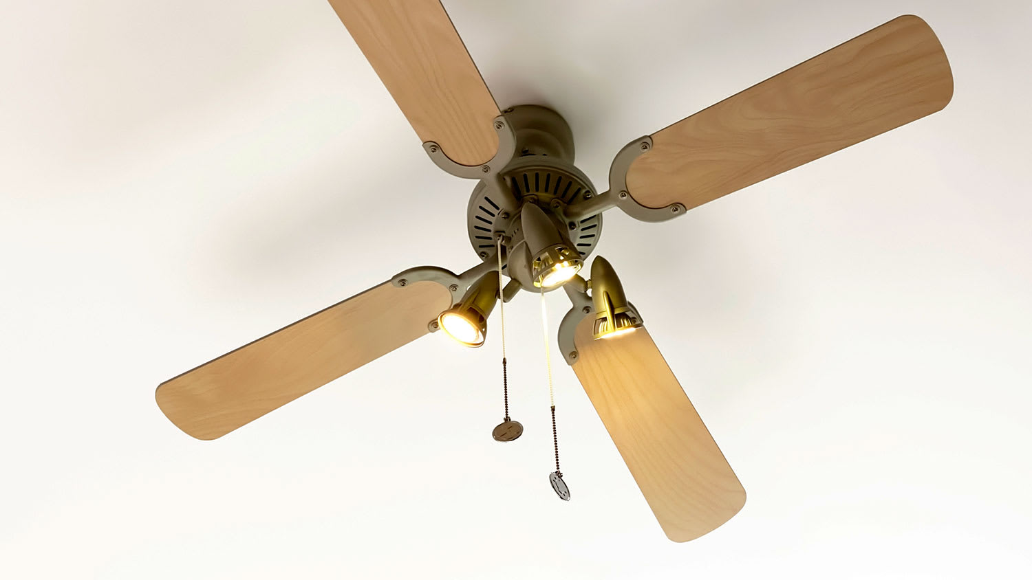 Closeup of a ceiling fan with the lights on
