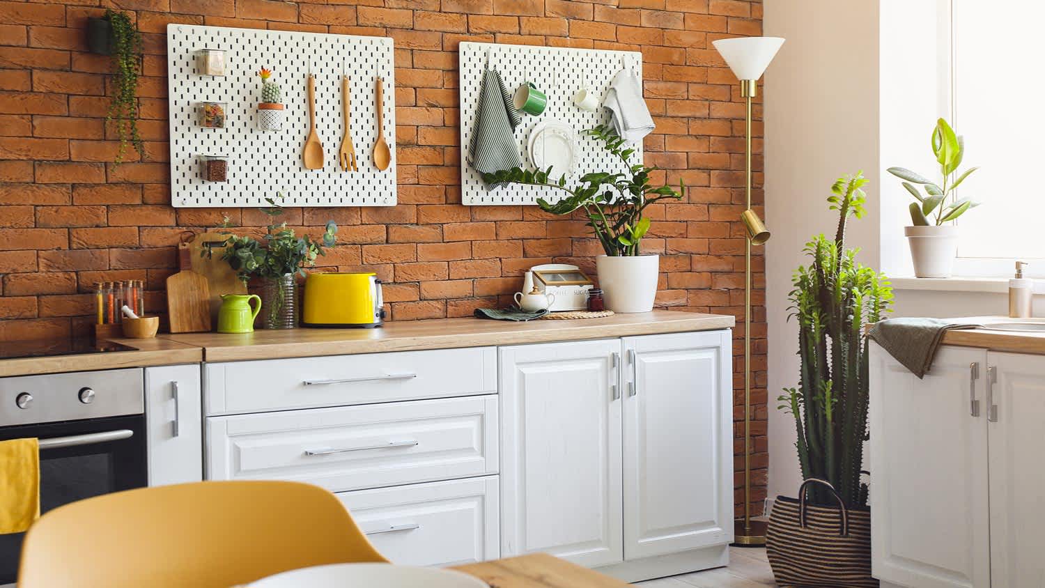 A brick kitchen with begboards
