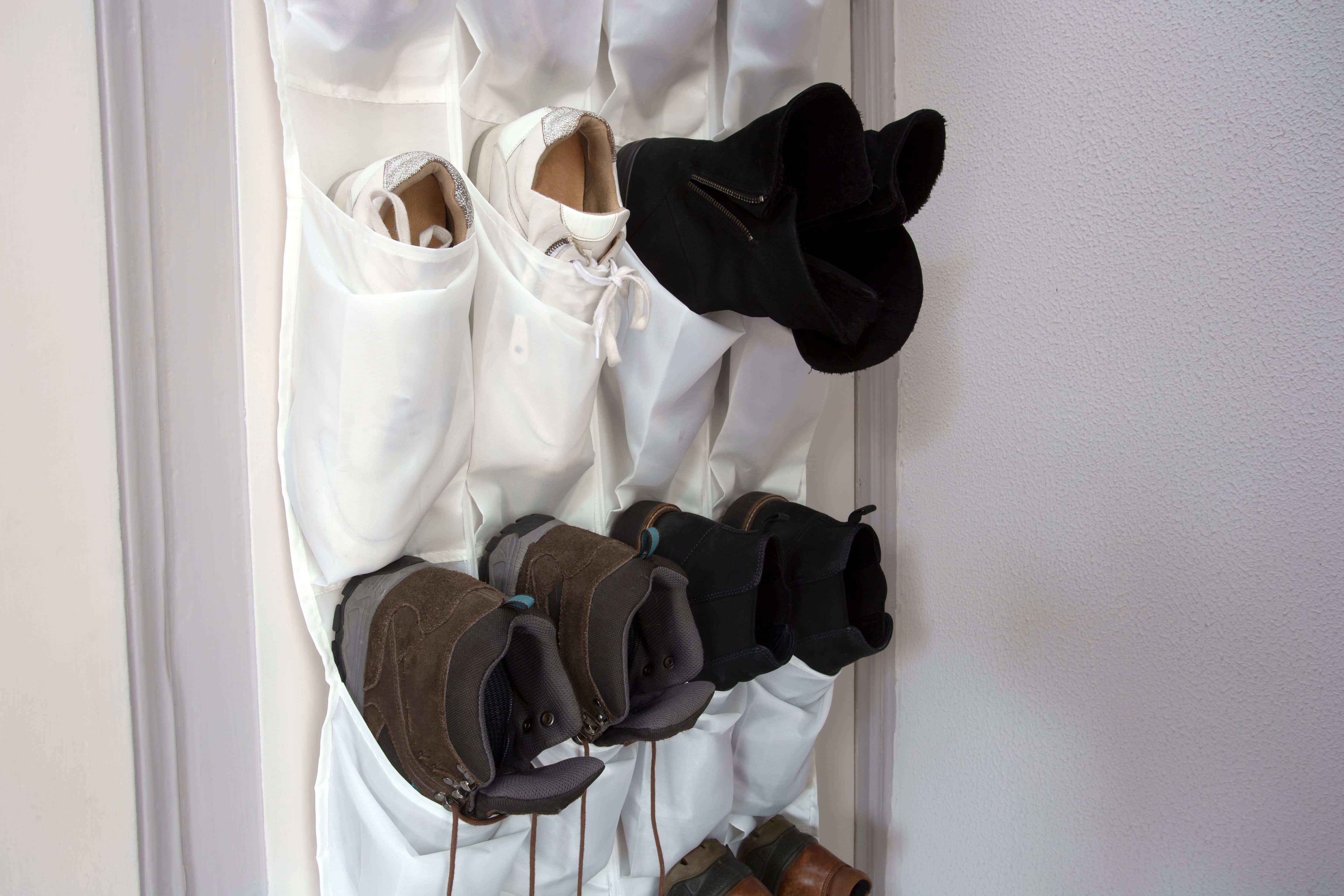Over the door hanging shoe rack with boots and sneakers