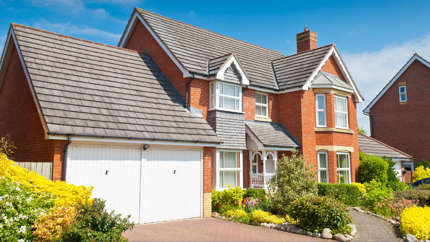 brick house exterior with garage as focal point