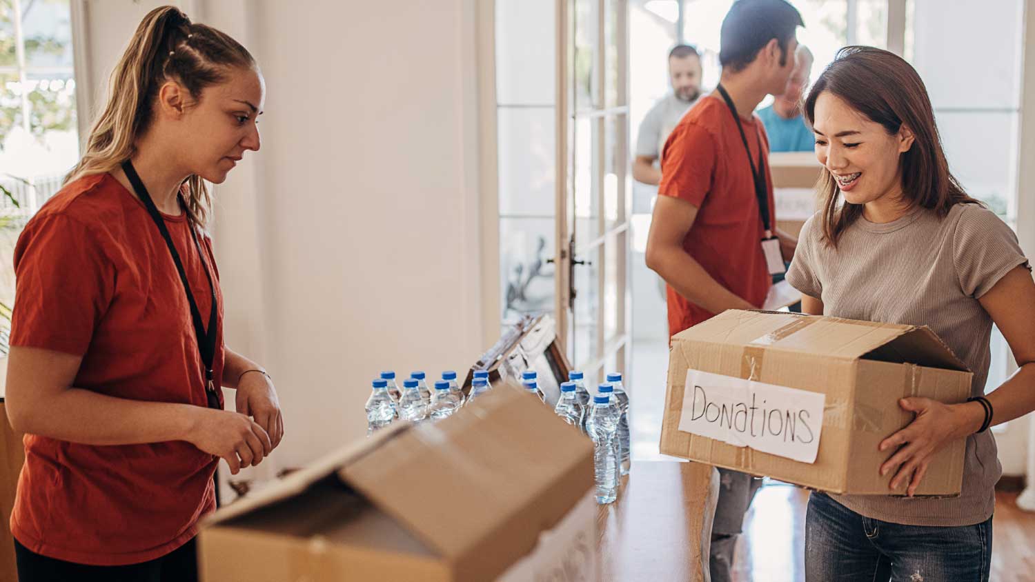 woman carrying donation box