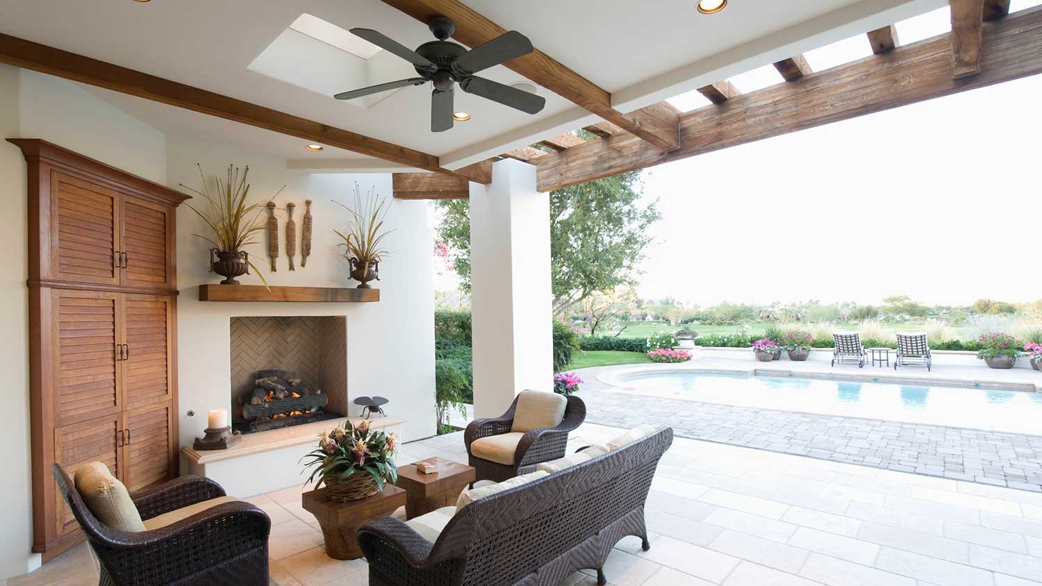 Covered outdoor seating area with ceiling fan