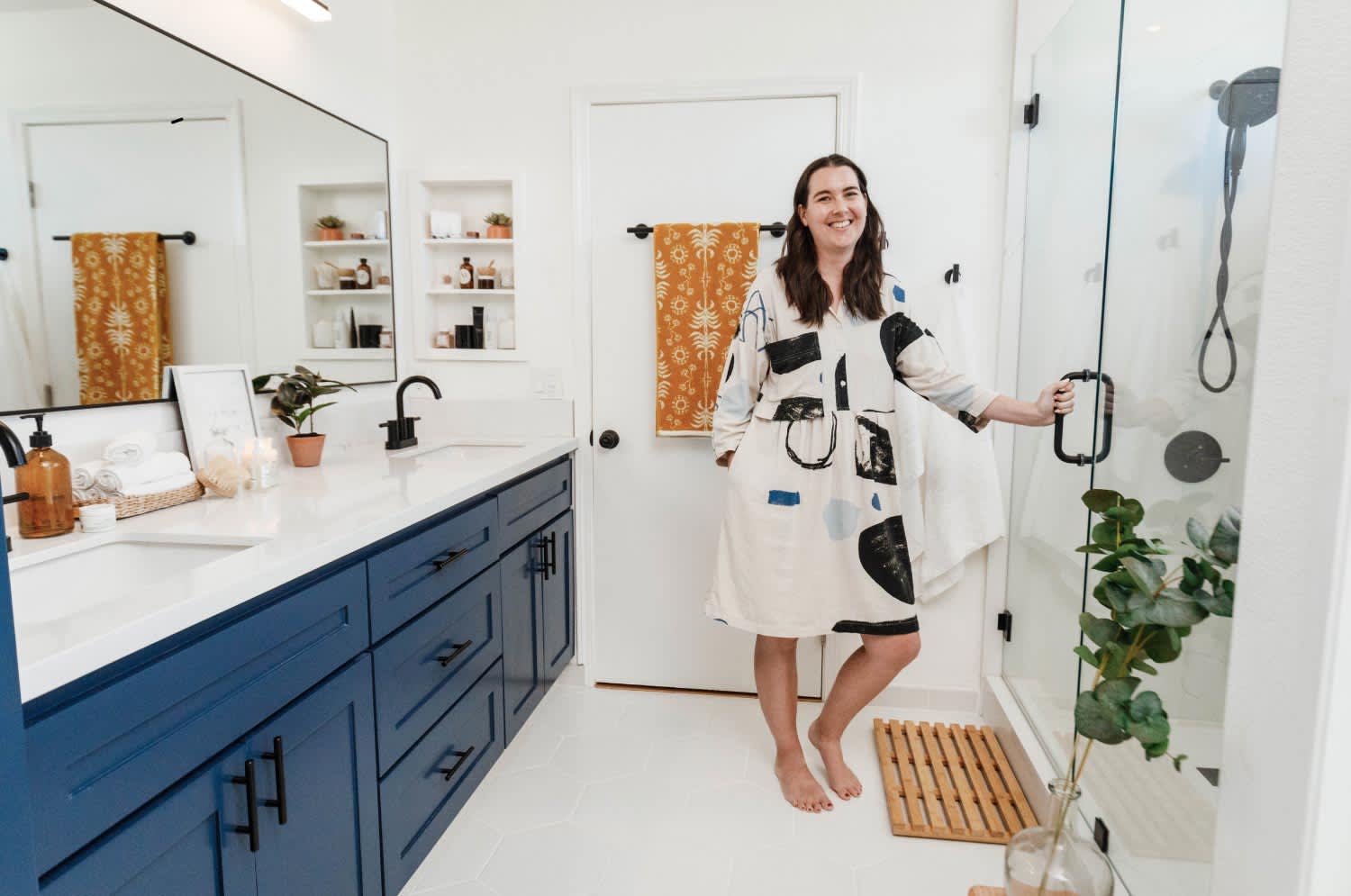 smiling woman opening shower door