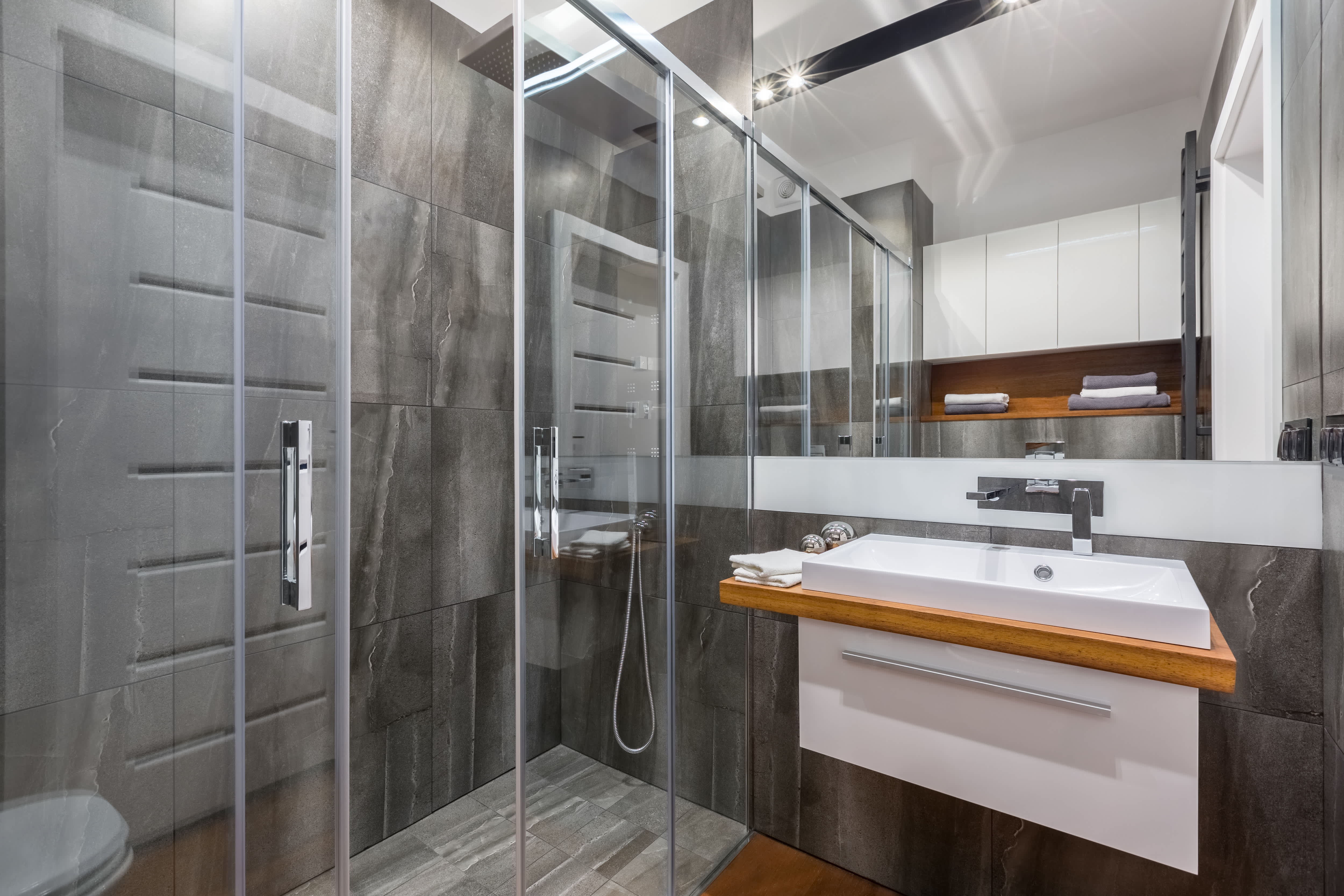 Walk-in shower with two center sliding glass doors
