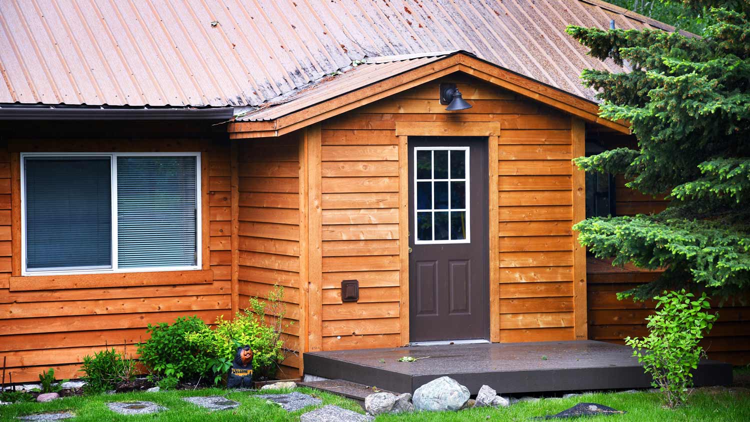 A cabin with cedar siding