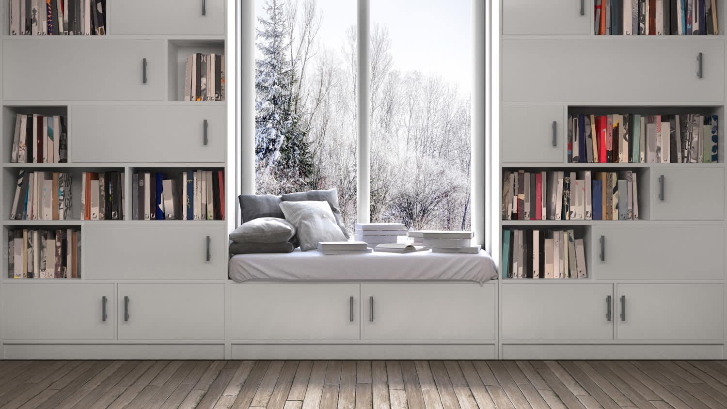 A window in a room framed by wooden bookshelves