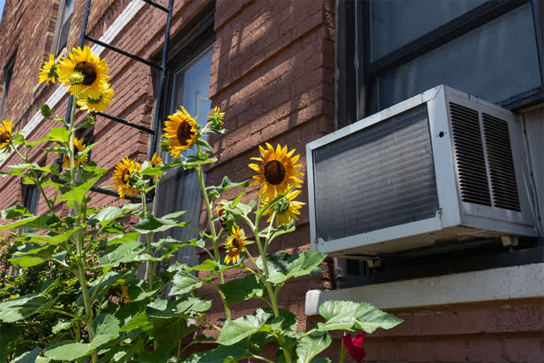 Window air conditioner outside of apartment
