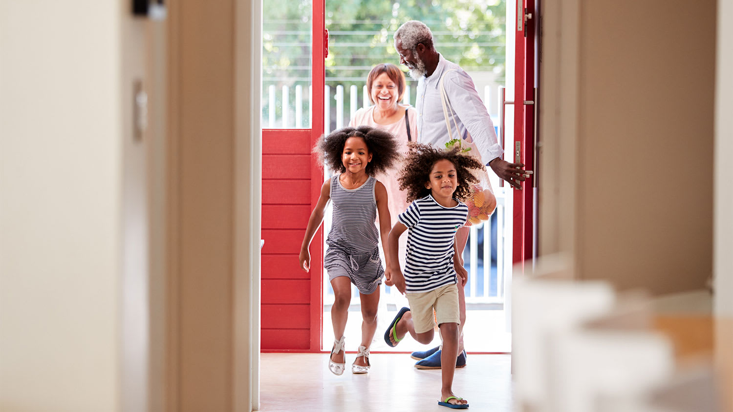 A family walks through front door