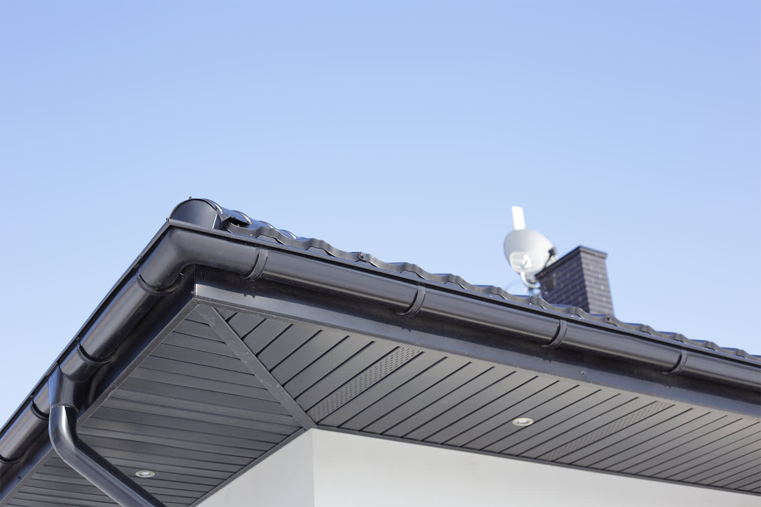 Dark colored gutters on home exterior