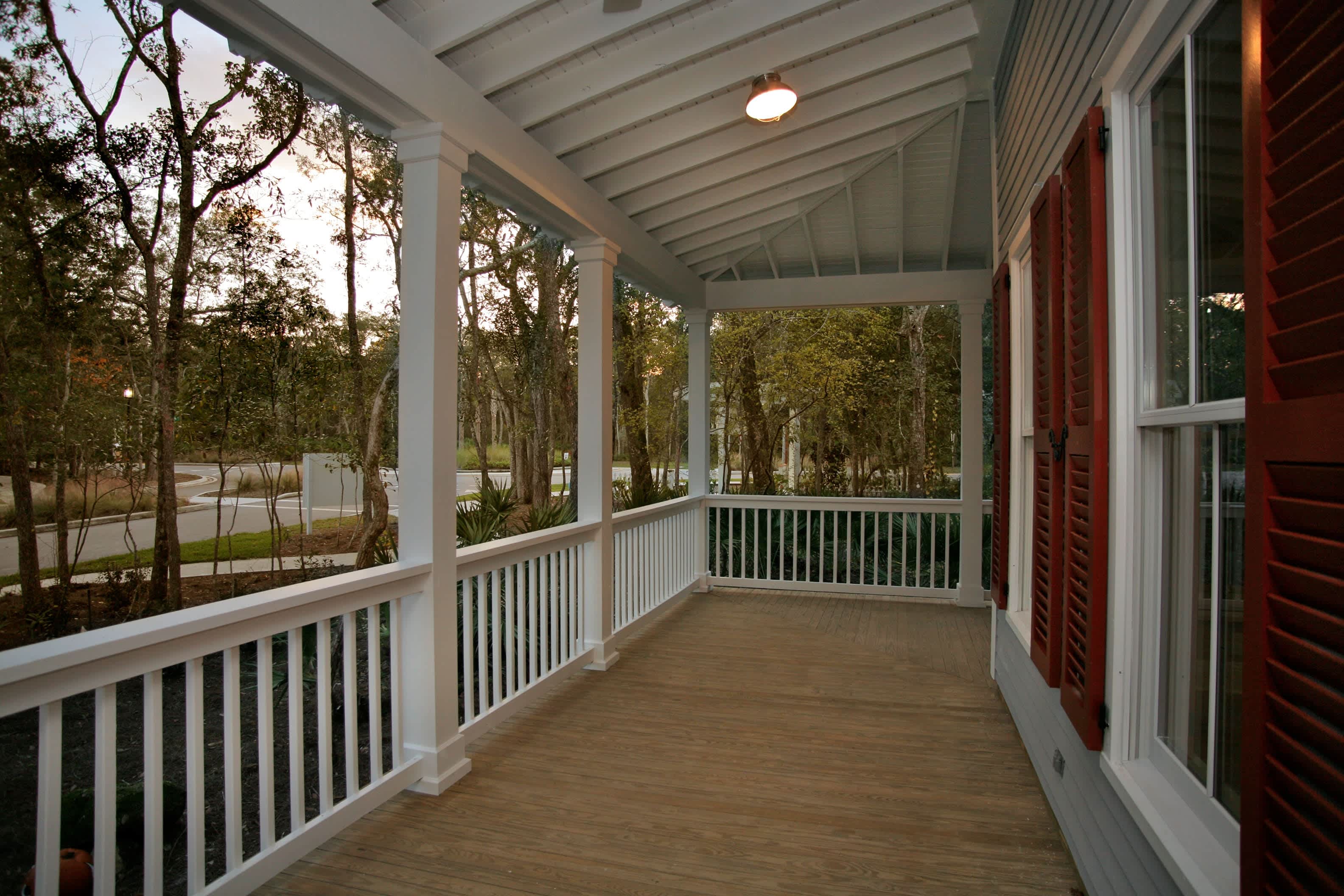 White vinyl railing along porch area