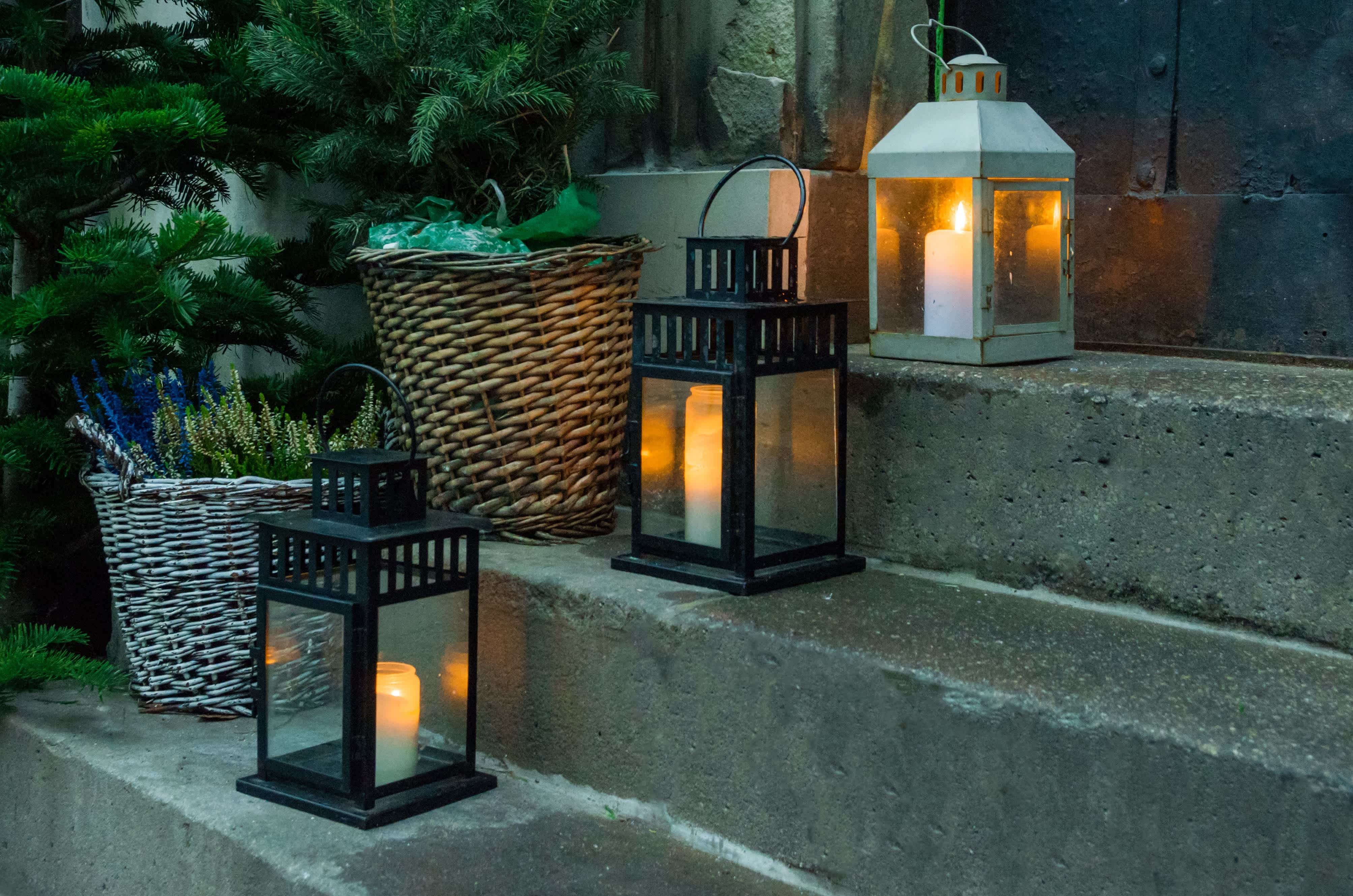 Lanterns and flower pots lining porch stairs