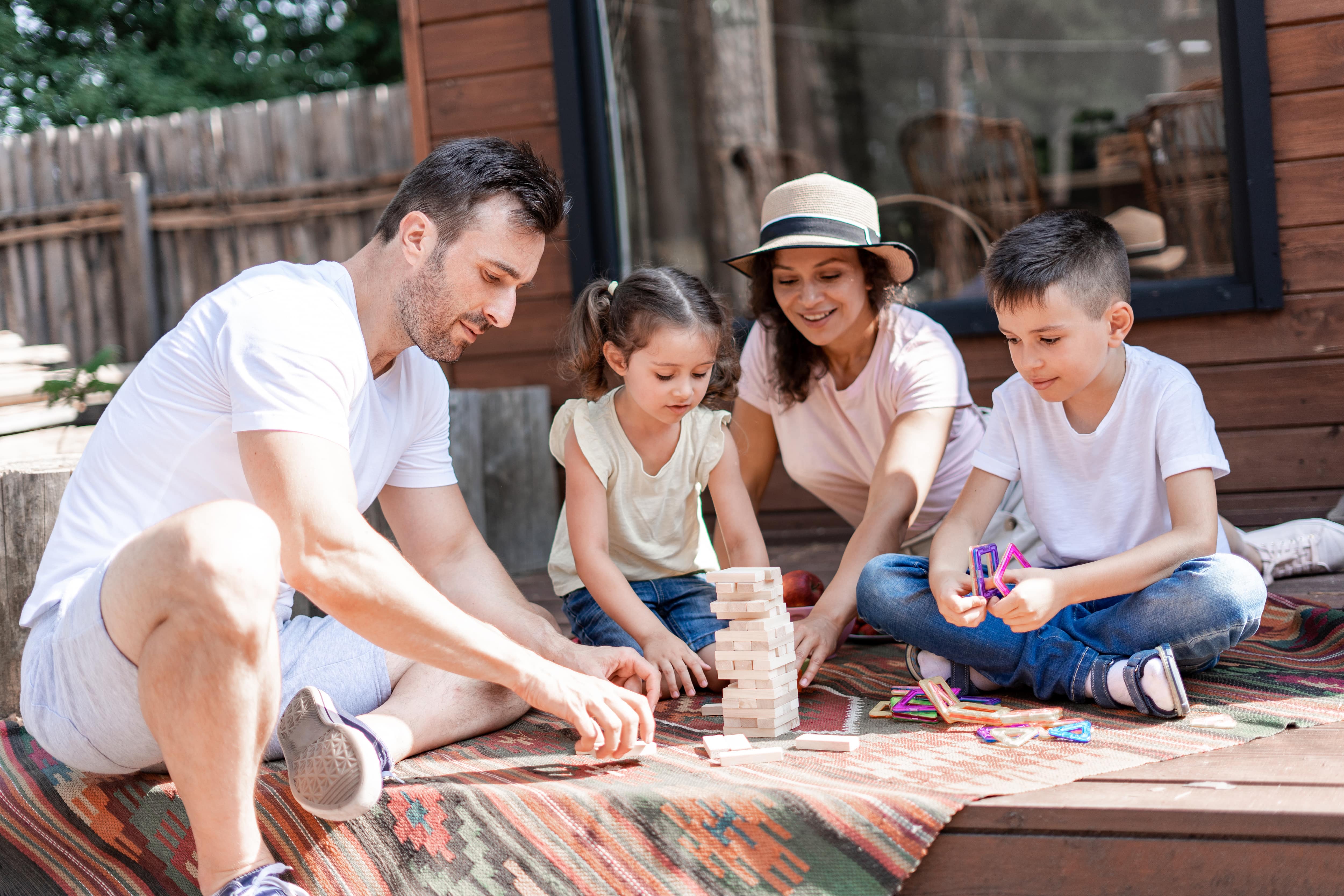 Family playing game on back porch
