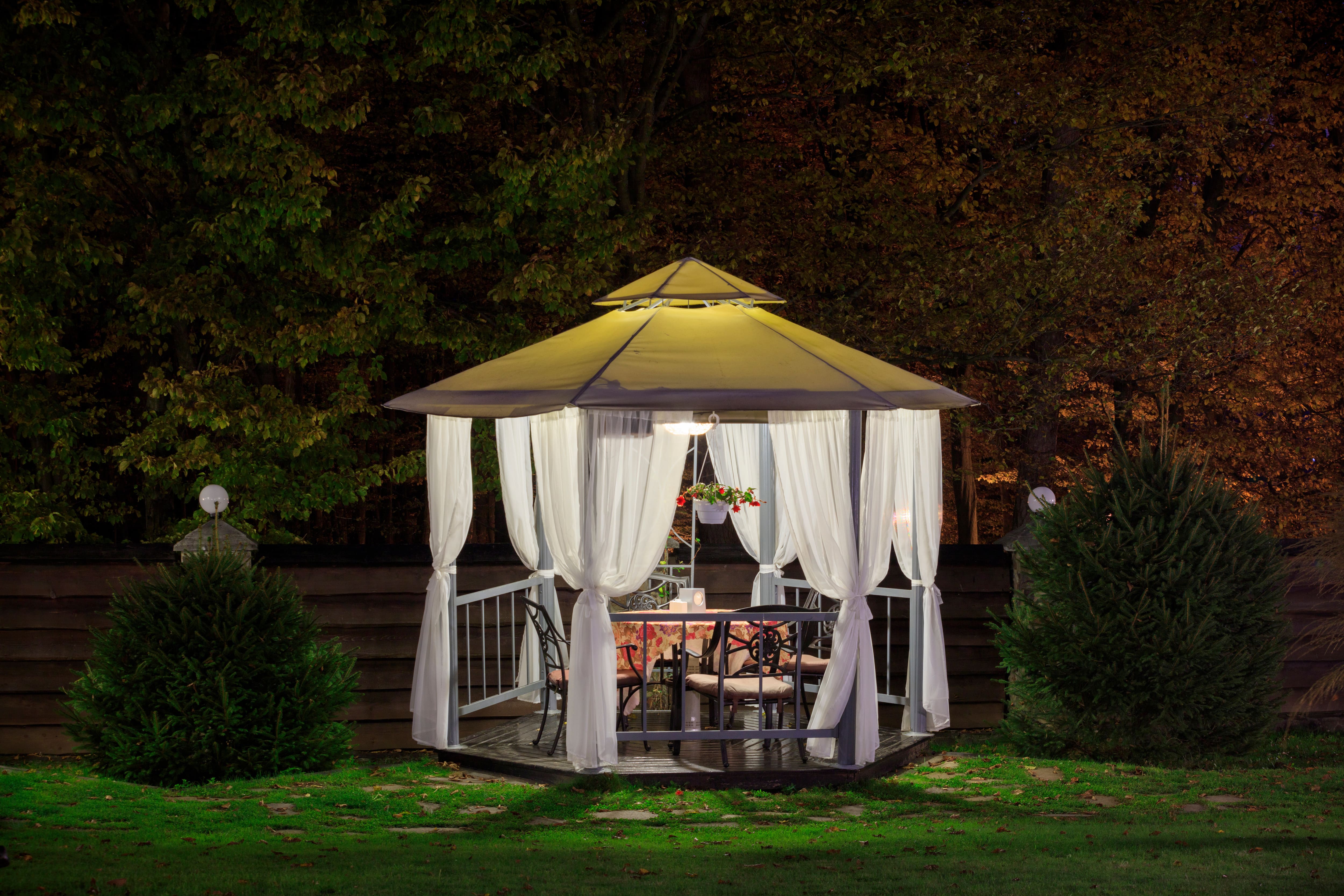 Gazebo at night with curtains
