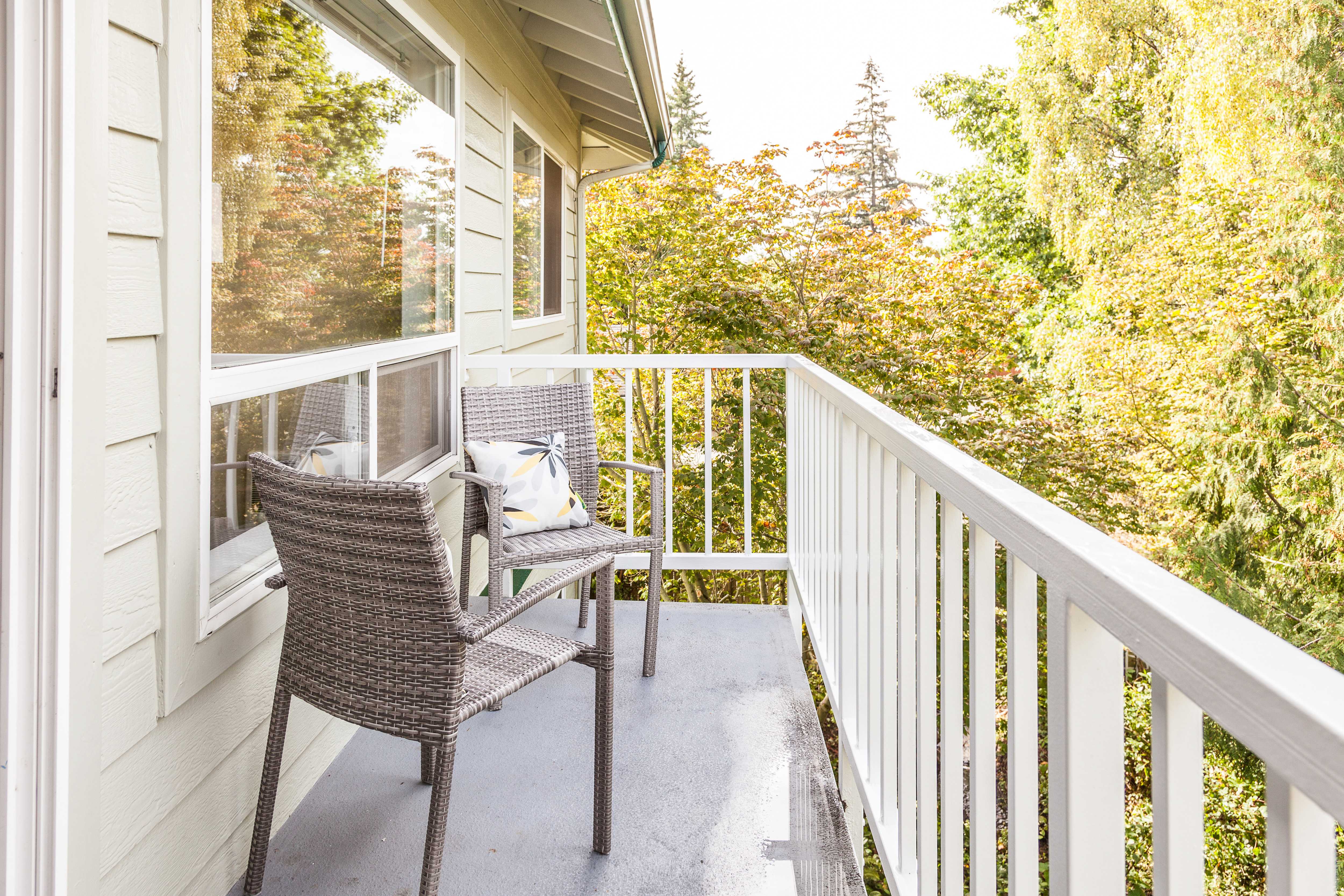 White vinyl railing enclosing small balcony