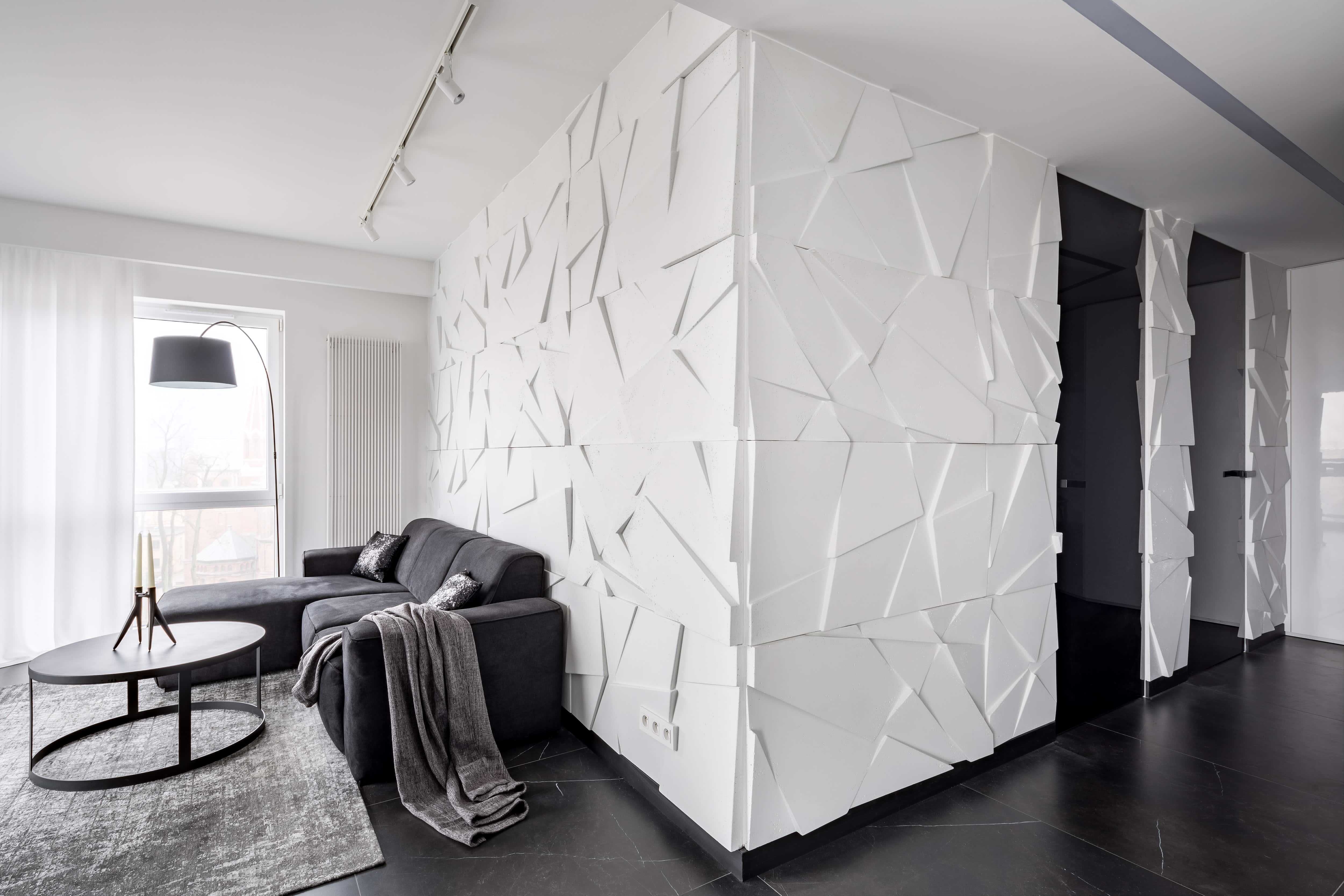 White 3D wall panels in living area