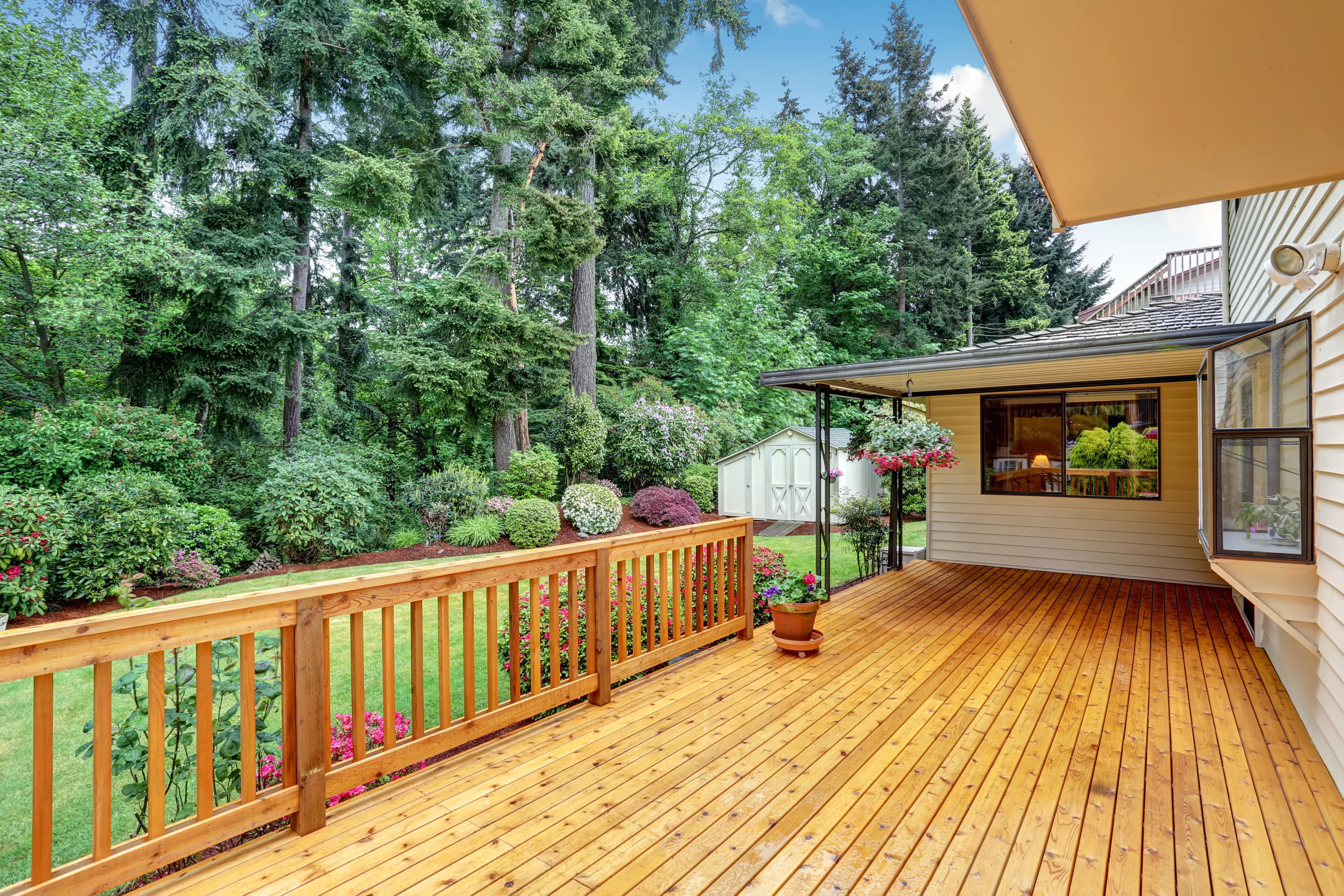 Wooden railing on wooden deck and back porch