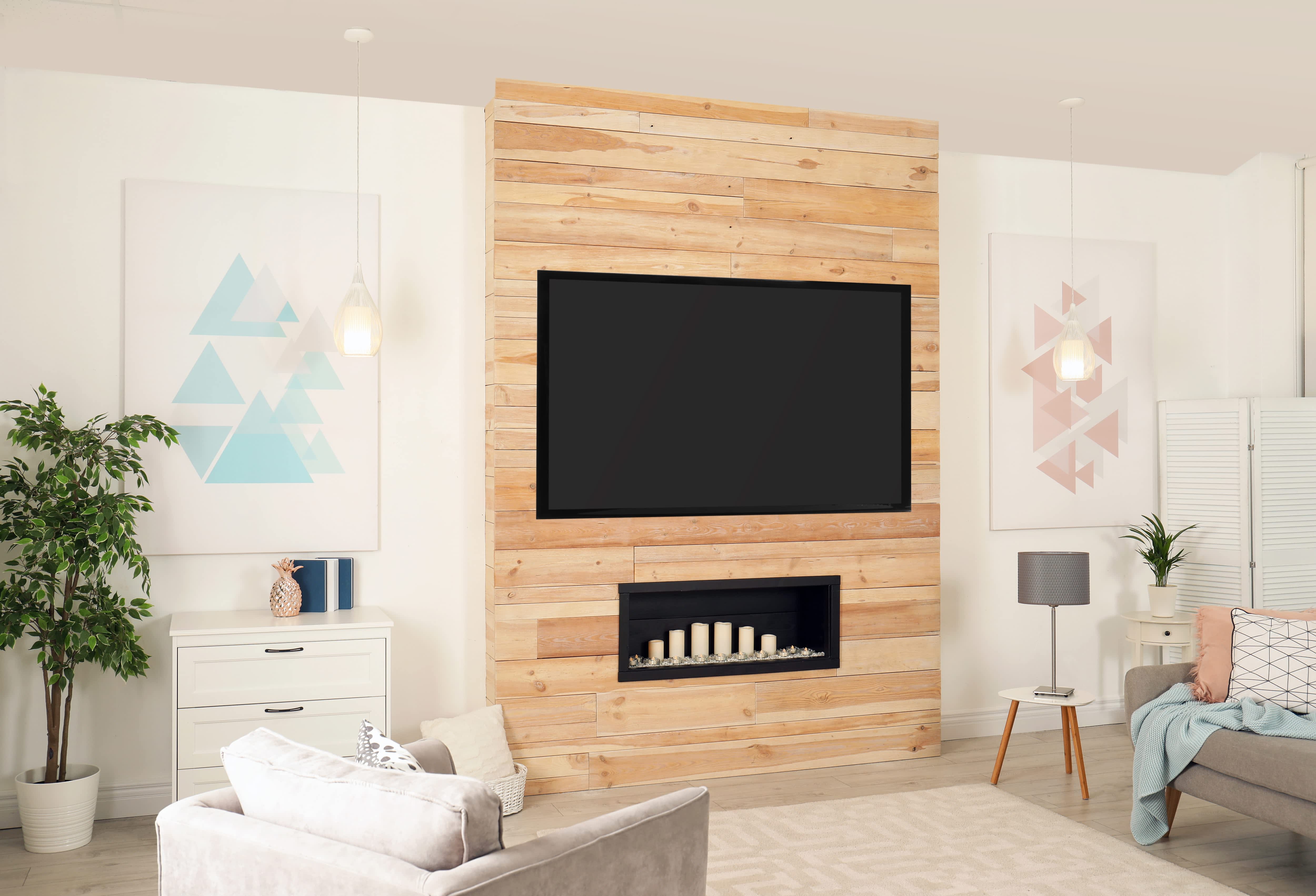 Pallet wood accent wall installed behind TV
